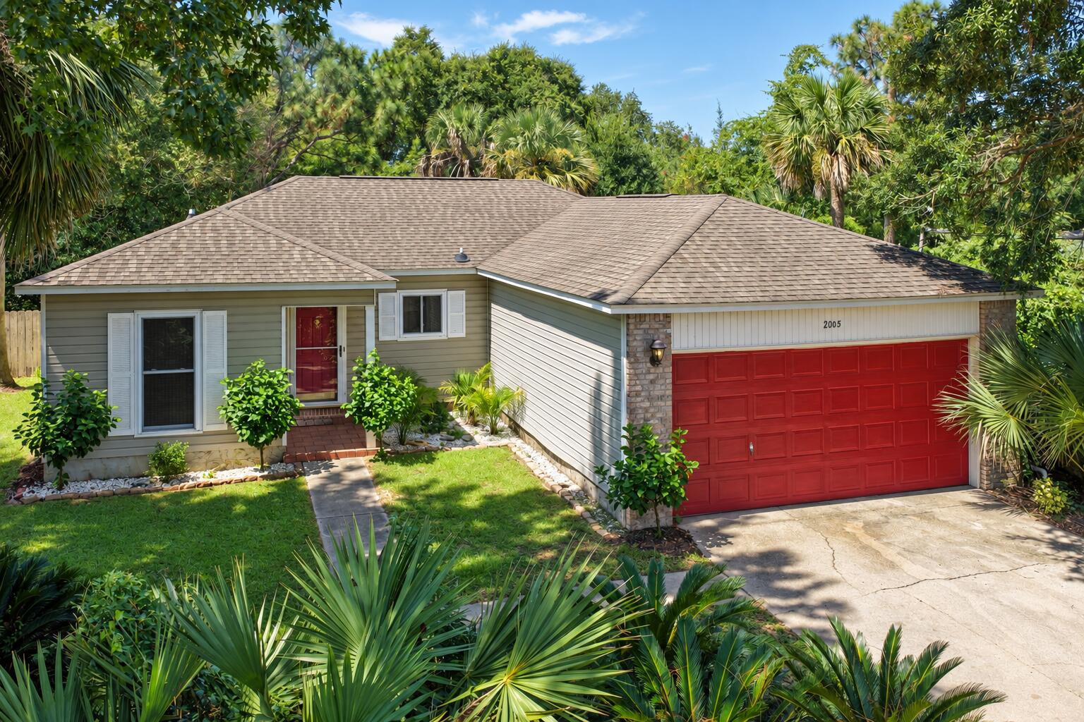 Prime opportunity and the lowest priced home in Navarre's established Holley by the Sea community! Situated on an expansive 0.46-acre lot, this single-story ranch offers 1,232 square feet, 3 bedrooms, 2 full bathrooms, and an attached two-car garage. This property is an unpolished gem that would benefit from updates throughout, making it an ideal candidate for investors or buyers with vision. The roof was replaced in 2019, removing a significant upfront capital expenditure. Inside, the functional layout features an entry hallway leading to two secondary bedrooms and a full bath, while the central living area connects to the kitchen and opens directly into an enclosed Florida room. The primary bedroom also features direct Florida room access and a private en suite bathroom. Outside, the large, mature parcel provides an exceptional footprint with ample space for gardening, a pool, and relaxation. 

Ownership in Holley by the Sea includes access to the extensive 48-acre, multi-million dollar recreation center, offering three swimming pools, eight lighted clay tennis courts, pickleball, a full gym, private sound-side beach access with a boat launch, and community pavilions. Conveniently located just off Highway 98 with quick commutes to Hurlburt Field, Eglin AFB, local schools, dining, and the white sand beaches of Navarre Beach. Schedule your showing today. A video tour is also available.
