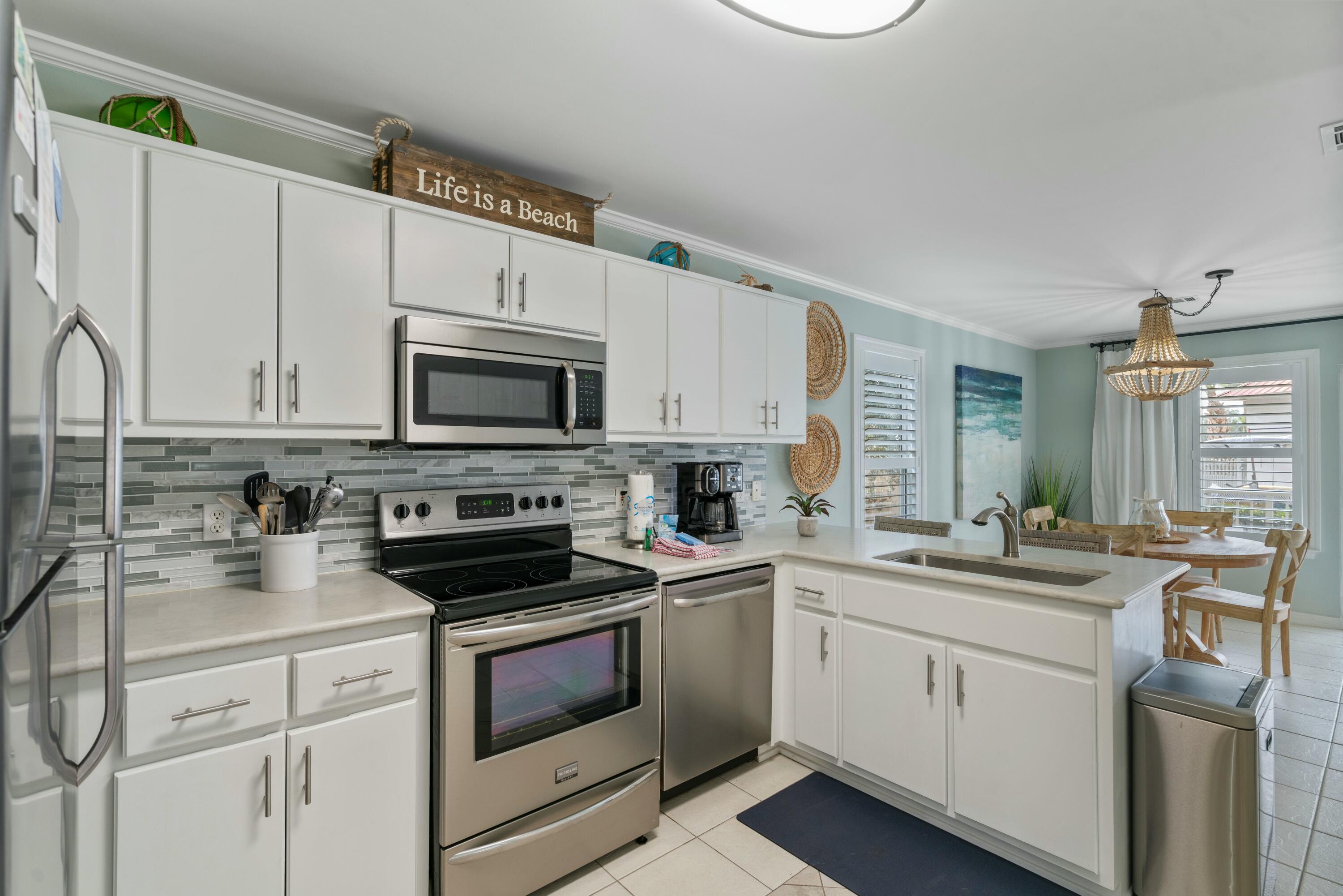 Nicely updated and well maintained unit in popular Rollin Tide Villas in Seagrove Beach!  Upgraded throughout, with quartz countertops, glass tile backsplash, and stainless appliances in the kitchen.  Shiplap feature wall in the bedroom with barn door access to the upgraded bathroom, again with a quartz countertop! The unit also features scraped ceilings with crown molding and plantation shutter window treatments.  Offered with tasteful,  modern coastal furnishings and decor.  Too much to list!  Relax at the pool directly behind the unit, with convenient bathrooms and 2 BBQ grill stations, or take a short walk to one of the multiple public beach access points nearby.  Schedule your showing today!