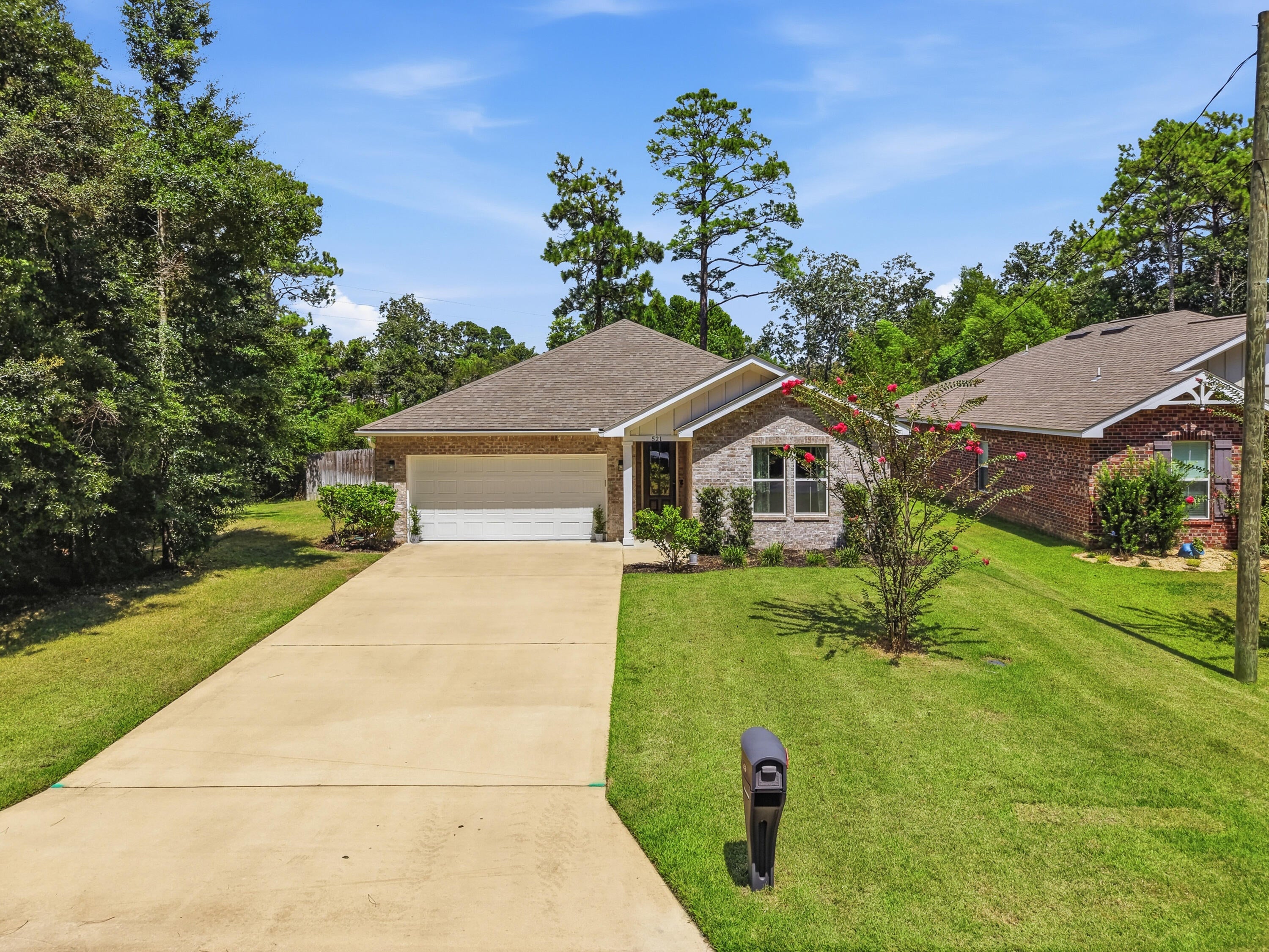 This is it! This beautiful 2020 built Craftsman Style brick home is ready for you to call yours. Offering 3 bedrooms, 2 bathrooms, and 1,595 square feet, this home features an inviting open-concept layout designed for comfortable everyday living. With no carpet throughout, the home transitions effortlessly from one space to the next.
Upon arrival, you'll find a beautifully maintained yard, clean, inviting curb appeal, and a spacious driveway. Step through the tall front door into a welcoming entryway that immediately feels like home. The thoughtfully designed split floor plan offers privacy and functionality, with additional bedrooms toward the front of the home and the owner's suite tucked away toward the back.
The spacious living room, dining area, and kitchen are beautifully lit by natural light streaming through multiple windows and a glass back door, creating a bright, welcoming atmosphere.
The owner's suite features a private bathroom with a double vanity, a tiled shower with a glass door, a walk-in closet with customizable shelving, and an additional linen closet for extra storage.
If the kitchen is one of your favorite spaces, you're going to love this one! It features updated stainless-steel appliances, quartz countertops, a farmhouse sink, and a pantry with custom shelving.
Step outside into the backyard, where a beautifully paved stone pathway leads to your fire pit and entertainment area, the perfect setting for evening gatherings, laughter, and relaxation. When the season is right, pick fresh blueberries from your very own blueberry bush to enjoy in your lemonade as you relax out back.
Additional features include a whole house surge protector, updated fiber optic broadband ready service, an active termite treatment already in place, a beautiful washer and dryer set, a fenced yard, a sprinkler system, gutters, dusk-to-dawn light bulbs along the garage, and a Ring doorbell and camera system that is motion activated.
Conveniently located just minutes from local military bases, the Emerald Coast's beautiful beaches, restaurants, shopping, and schools, this home offers the perfect blend of comfort, convenience, and Florida living.
There are so many wonderful qualities to love in this home. Don't miss your chance to make it yours!
Buyer(s) are responsible for verifying ALL data and information, including lot size and room measurements, as it is deemed to be reliable but not guaranteed.