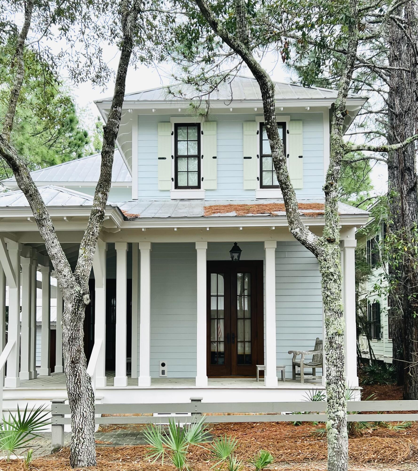 Rare opportunity to own a never rented Watercolor home! / Positioned perfectly along Spartina circle's grass field and steps away from the newly completed Camp Watercolor this home offers a discriminating blend of casual elegance and hospitality with a chic twist that are evident as you enter this magnificent home. Being a three story, this four bedroom, four bath home offers lovely interiors furnished with many French antiques under the guidance of designer, French Country Imports and Lynda Shea Designs of Memphis, TN.
As you enter through the foyer a beautiful 19th century hand painted Swedish armoire. This large open floor plan with ten foot ceilings throughout, provide ample room to entertain your guest. This home boast large Mahogany true French doors throughout and large plank