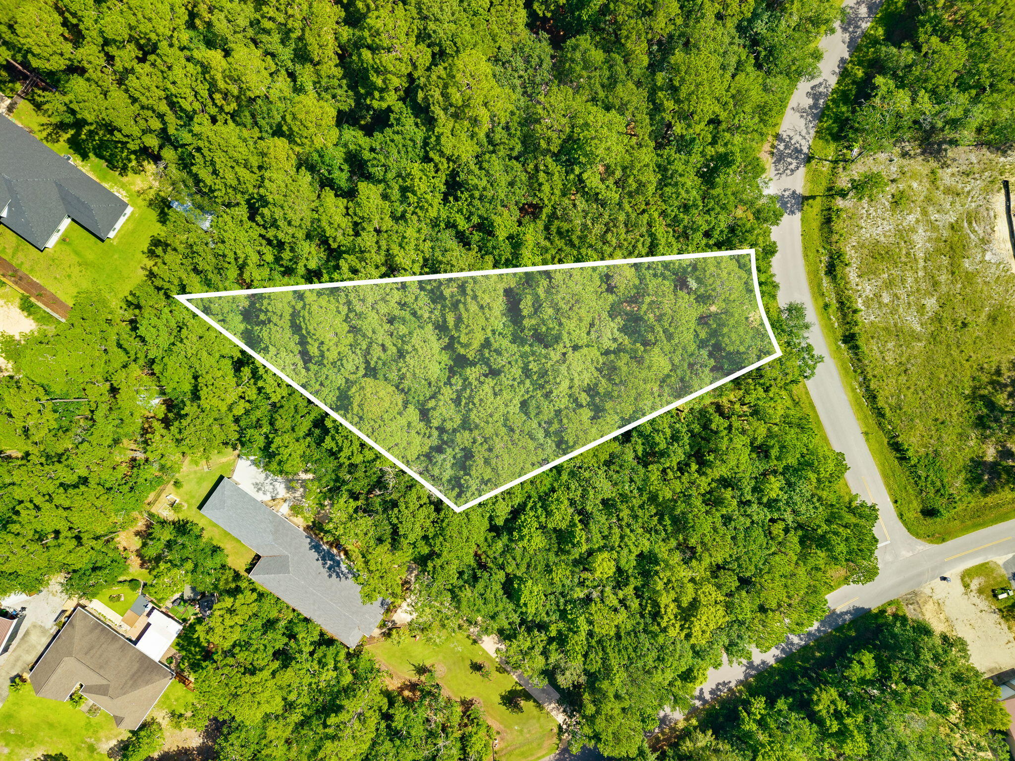 Rare opportunity to build your dream home on this generously sized 0.88-acre, pie-shaped homesite in LaGrange Shores, a desirable Freeport community offering the natural beauty and laid-back coastal lifestyle of the Emerald Coast. Lot B21 on Narcissus Drive features beautiful bay views, public water and sewer availability, and a unique configuration offering flexibility for thoughtful home design. The expansive homesite provides an exceptional setting for a custom 2- or 3-story residence designed to maximize views and outdoor living. Conveniently located approximately 17 miles from the beaches of 30A, with easy access to Freeport, Choctawhatchee Bay, boating, fishing and South Walton. Whether you're envisioning a full-time residence, second home or investment property, this is an opportunity to create a custom coastal retreat in an increasingly sought-after area.