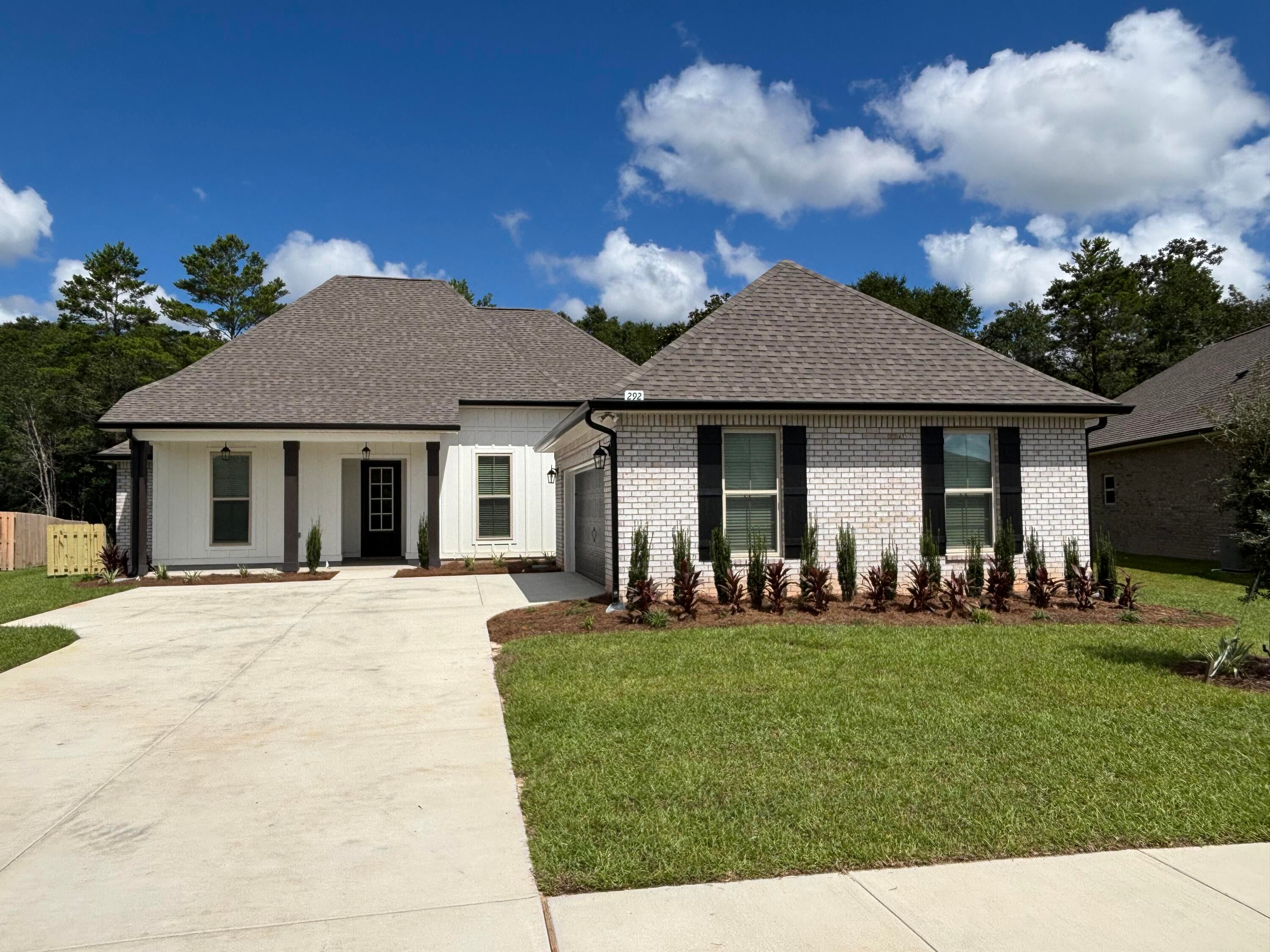 The RENOIR IV I in Bird Song at Hammock Bay community offers a 4BR/3BA, open design with separate dining room and breakfast area. Upgrades added (list attached). Features: double vanity, garden tub, separate custom tiled shower, and walk-in closet in master bathroom, double vanity in 2nd bathroom, walk-in closet in all other bedrooms, kitchen island, walk-in pantry, boot bench and drop zone in mudroom, covered porches, side entry garage, undermount sinks, custom kitchen backsplash, cabinet hardware, crown molding, LED lighting, smart connect WIFI thermostat, framed mirrors in all bathrooms, landscaping package, architectural 30-year shingles, flood lights, and more! Energy Efficient Features: water heater, electric kitchen appliance package, vinyl low E windows, and more! Energy Star Partner.