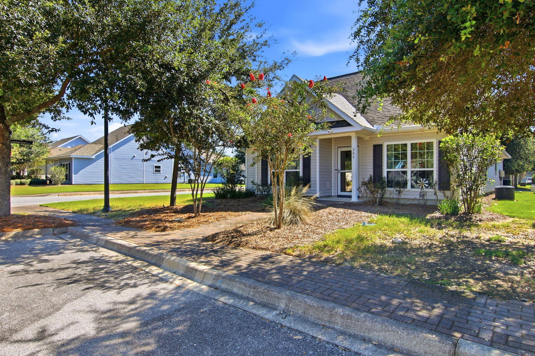 Charming Welcome home to this beautifully maintained 3-bedroom, 2-bath residence ideally situated on a desirable corner lot in the heart of Hammock Bay. Designed for easy, comfortable living, this home offers a calming interior color palette and thoughtful upgrades throughout, creating a space that feels both stylish and inviting from the moment you arrive.

Inside, you'll find a welcoming spacious foyer leading you in to the open concept floor plan; flowing with natural light, charming shiplap accent walls, updated lighting, and arched entry doorways that add an architectural touch with an elevated, custom feel.

The attached two-car garage is conveniently located at the rear of the home, while additional street parking and a dedicated walkway provide easy access to the front door. Step outside and enjoy the convenience of maintenance-free landscaping, allowing you to spend less time on yard work and more time enjoying everything Hammock Bay has to offer.

Perfectly positioned within a short walking distance to community amenities and neighborhood events, this home puts the best of Hammock Bay right outside your door. Whether you're enjoying a quiet evening at home or taking advantage of the vibrant community lifestyle, this is a place that makes everyday living feel easy, comfortable, and connected.

Consider this your official invitation to experience what the Hammock Bay lifestyle is all about and schedule your showing today!