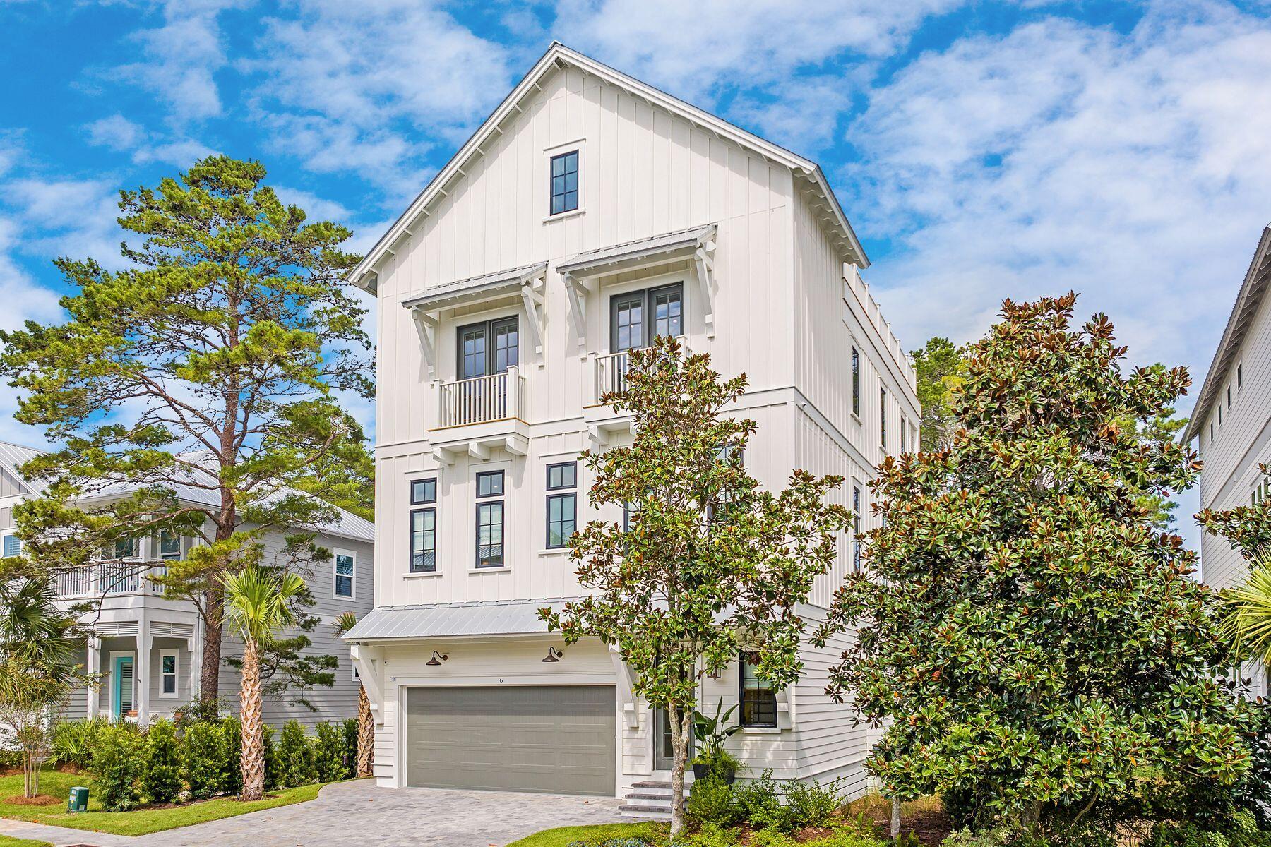Artfully blending contemporary coastal design with everyday functionality, this four-story home currently under construction by 30A Builders delivers 3,728 square feet of inspired living space in the heart of Grande Pointe. Backing up to the protected greenspace of Camp Helen State Park, this home offers a serene setting with no backyard neighbors--and Gulf views from the top floor to complete the experience.
The first floor features a private guest suite with a full bath, plus a flexible bonus room ideal as a home office, playroom, or bunk room. Step outside to your private backyard oasis with lush landscaping and large fenced yard, perfect for entertaining or relaxing in total privacy. Estimated completion is December 2026