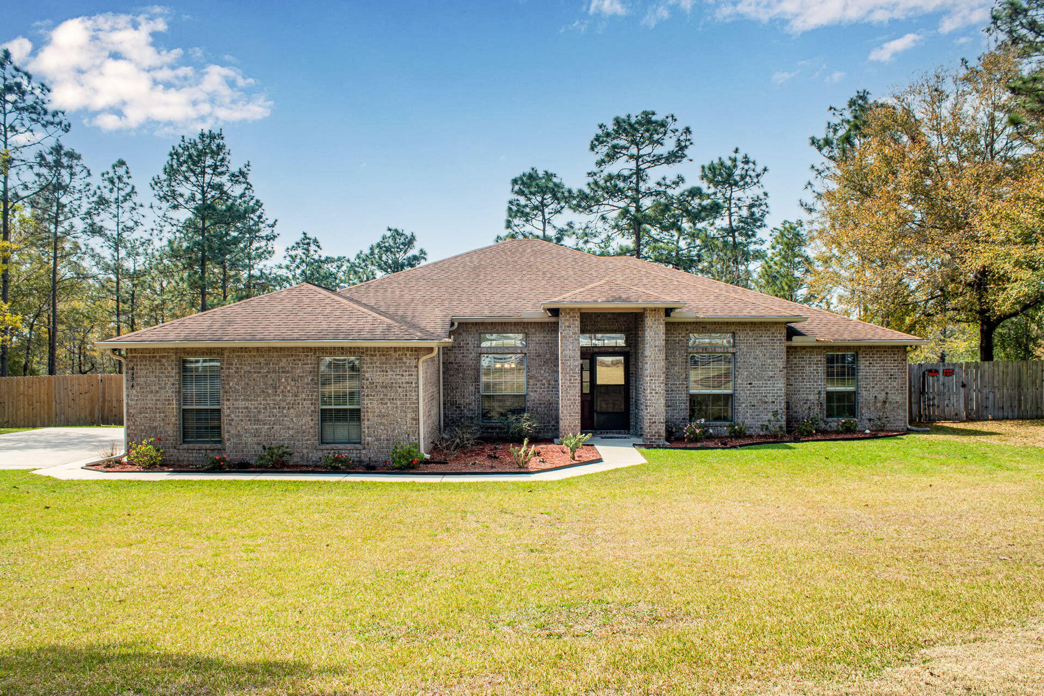 Spacious 5-bedroom, 3-bath brick home in Yellow River Plantation situated on over an acre. This 2,736 SF home features an open floor plan, split-bedroom layout, updated kitchen with new appliances, recessed lighting, and a large screened porch overlooking the backyard. Additional features include a 2-car garage, bamboo wood and tile flooring, and plenty of outdoor space to enjoy. Conveniently located with easy access to Crestview while offering the privacy of country living.