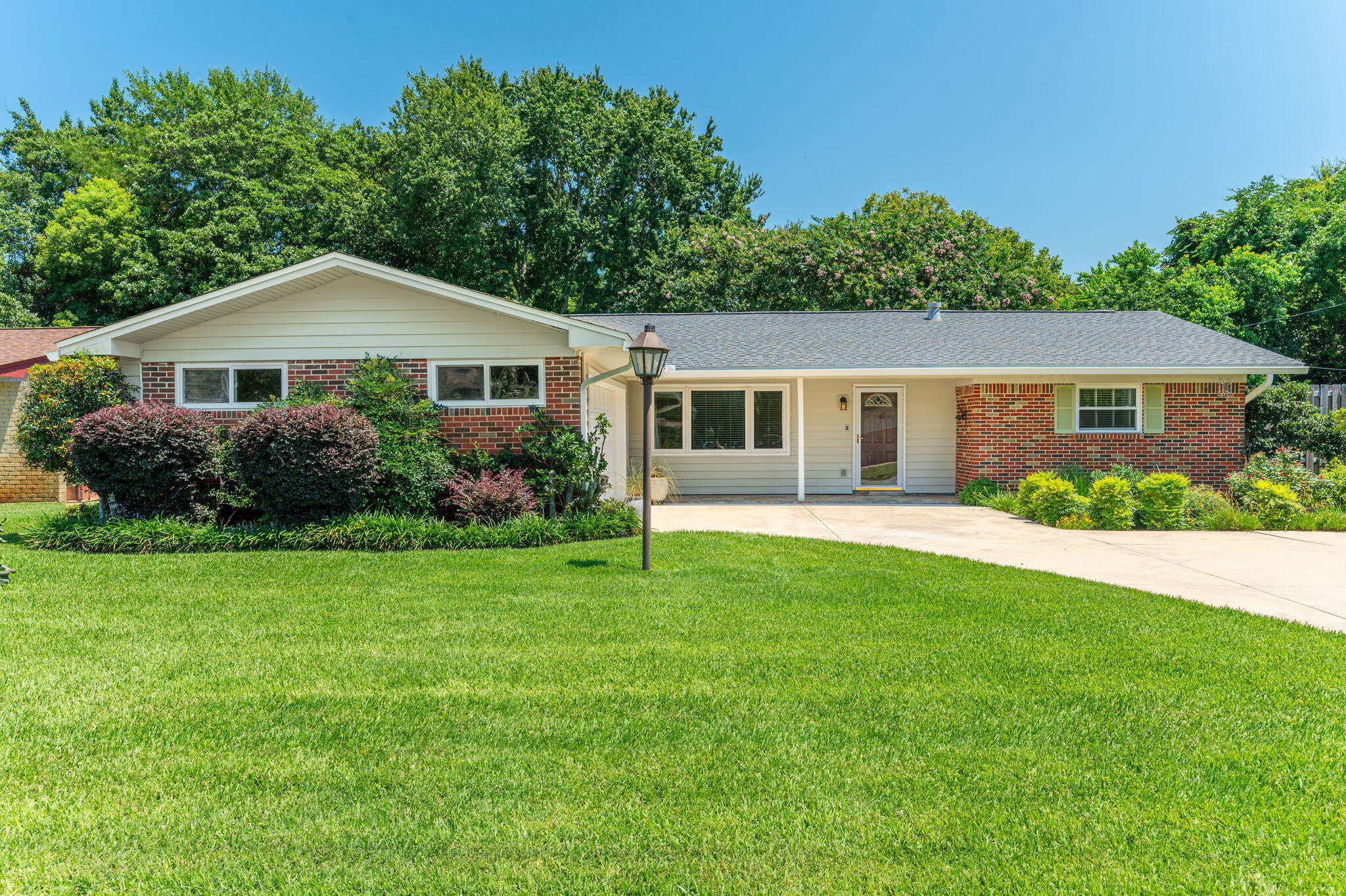 Welcome home to this beautiful all-brick ranch situated in a quiet, established neighborhood. From the moment you arrive, the expansive, manicured green lawn and massive driveway give this property incredible curb appeal.
Step inside to a bright, open floor plan featuring a spacious living area with beautiful wood floors, fresh neutral paint, and a sleek modern fixtures. The massive sliding glass doors flood the space with natural light and lead out to your own private backyard oasis, complete with a sparkling swimming pool and covered patio, perfect for entertaining. The house features 3 large, comfortable bedrooms, an updated open kitchen concept with a breakfast bar, indoor laundry, and an attached two-car garage. Best of all, you're just minutes away from schools, shopping, and the beach! All of the majors have already been replaced! Roof 2022, HVAC 2021, HWH 2018, Impact Windows, Siding & Doors 2018