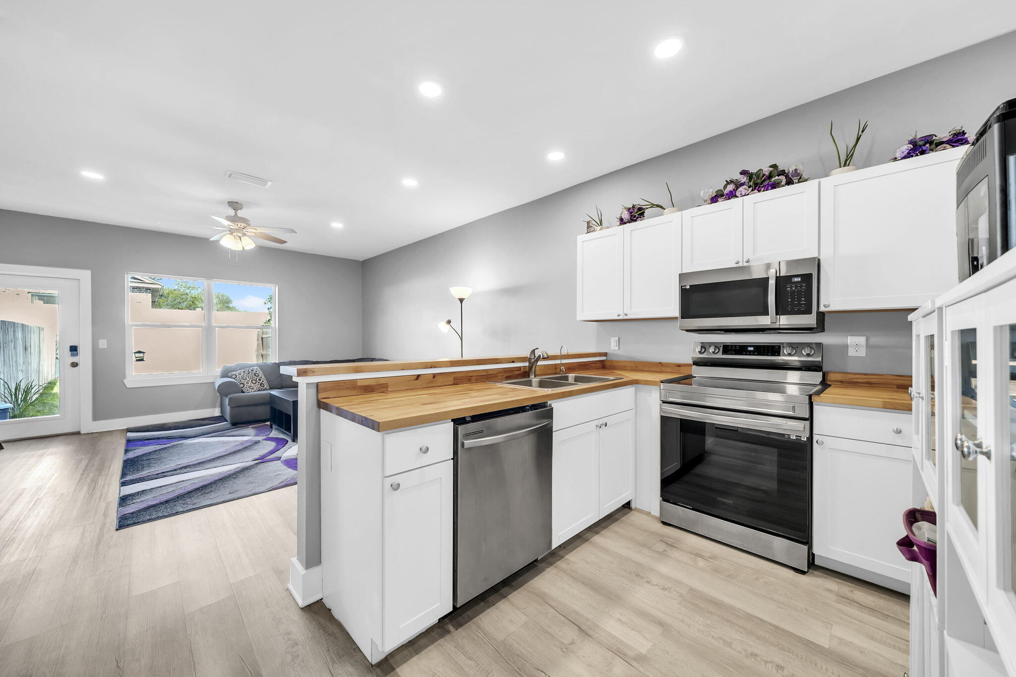 Perfectly positioned in the heart of Destin, this beautifully designed 3-bedroom, 3 full bathroom townhome offers 1,386 square feet of stylish and functional living -- all with the rare advantage of NO HOA and no monthly fees. Located within walking distance to both Destin Elementary and Destin Middle School, this exceptional property is also just minutes from the sugar-white beaches, championship golf courses, premier shopping, and top dining destinations that make Destin so desirable.

Inside, the home showcases modern coastal finishes throughout, including gorgeous white shaker cabinetry, stainless steel appliances, a custom chop block countertop, and a spacious pantry in the kitchen. The open-concept layout is complemented by soaring 9-foot ceilings, luxury vinyl plank flooring throughout the downstairs living areas and all bathrooms, elegant 6-inch baseboards, and vinyl single-hung impact windows that provide both style and peace of mind.

Each bathroom has been thoughtfully upgraded with stainless and porcelain sinks, along with LED light-touch mirrors featuring built-in anti-fog technology for a sleek, luxury feel. Additional highlights include a large first-floor storage closet, a spacious private back porch perfect for enjoying breathtaking sunset views, and an oversized 3-car driveway offering ample parking.

One of the most convenient features of this location is the ability to access the Mid-Bay Bridge without ever getting onto Highway 98, making commuting EASY! Whether you're searching for a primary residence, second home, or investment opportunity, this Destin property delivers comfort, convenience, and modern coastal living at its finest.