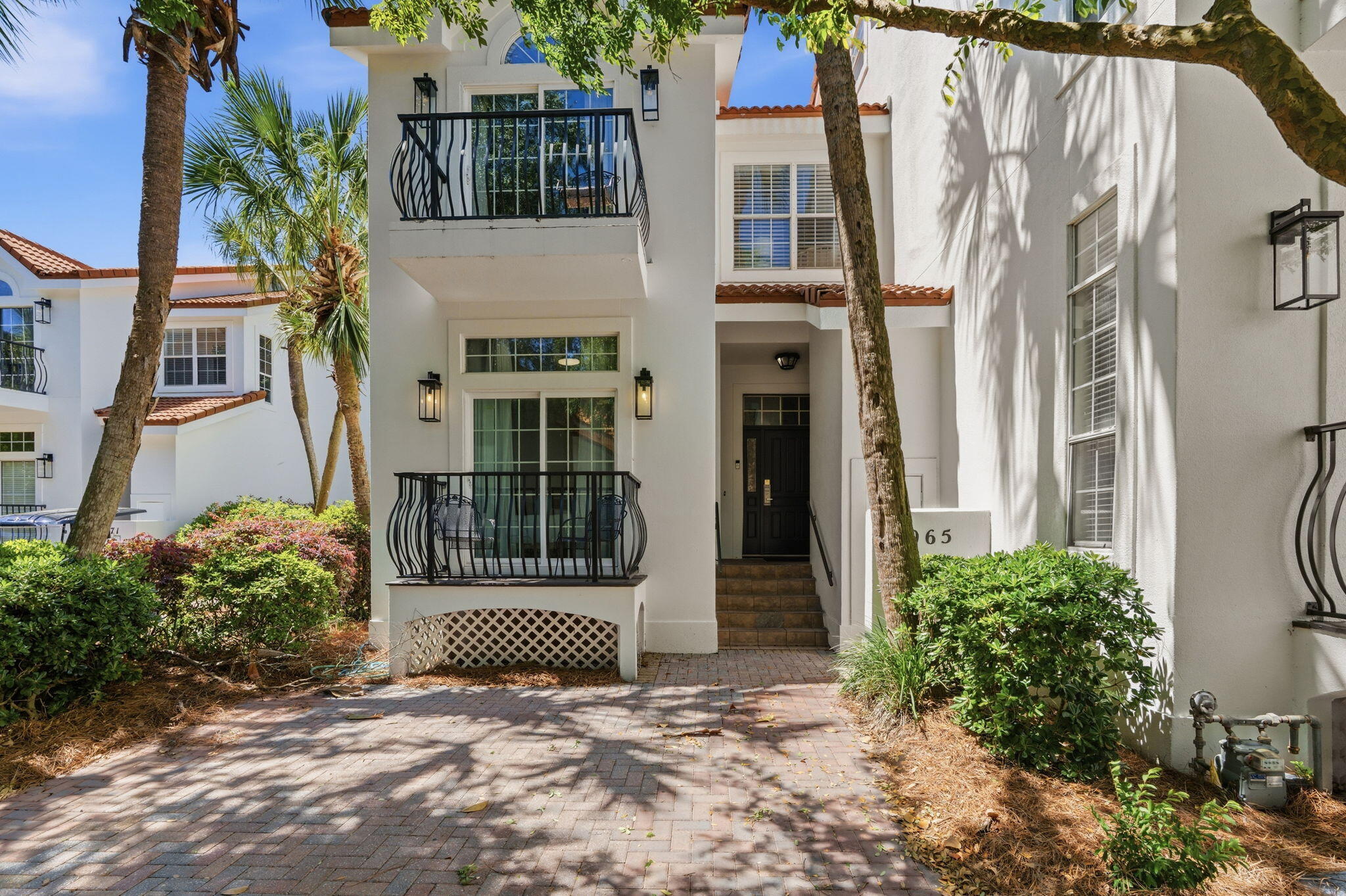 Fully furnished 5BR/3BA townhome in Sandestin, located on the 8th hole w/ bay views. This 3-level home features high ceilings, a guest room w/ bath & balcony on the main floor, gourmet kitchen, open living area w/ fireplace, laundry & screened-in porch overlooking the golf course. The second level includes a spacious primary suite w/ vaulted ceiling, sitting area, fireplace, large bath w/ double closets, tile shower & private deck, plus 2 more bedrooms & baths. Top floor offers a huge private guest room. Skylight in stairway brings in great natural light. Located in a golf cart-friendly, amenity-rich resort community perfect as a primary home, second home, or rental with beaches, golf & Sandestin's top amenities.