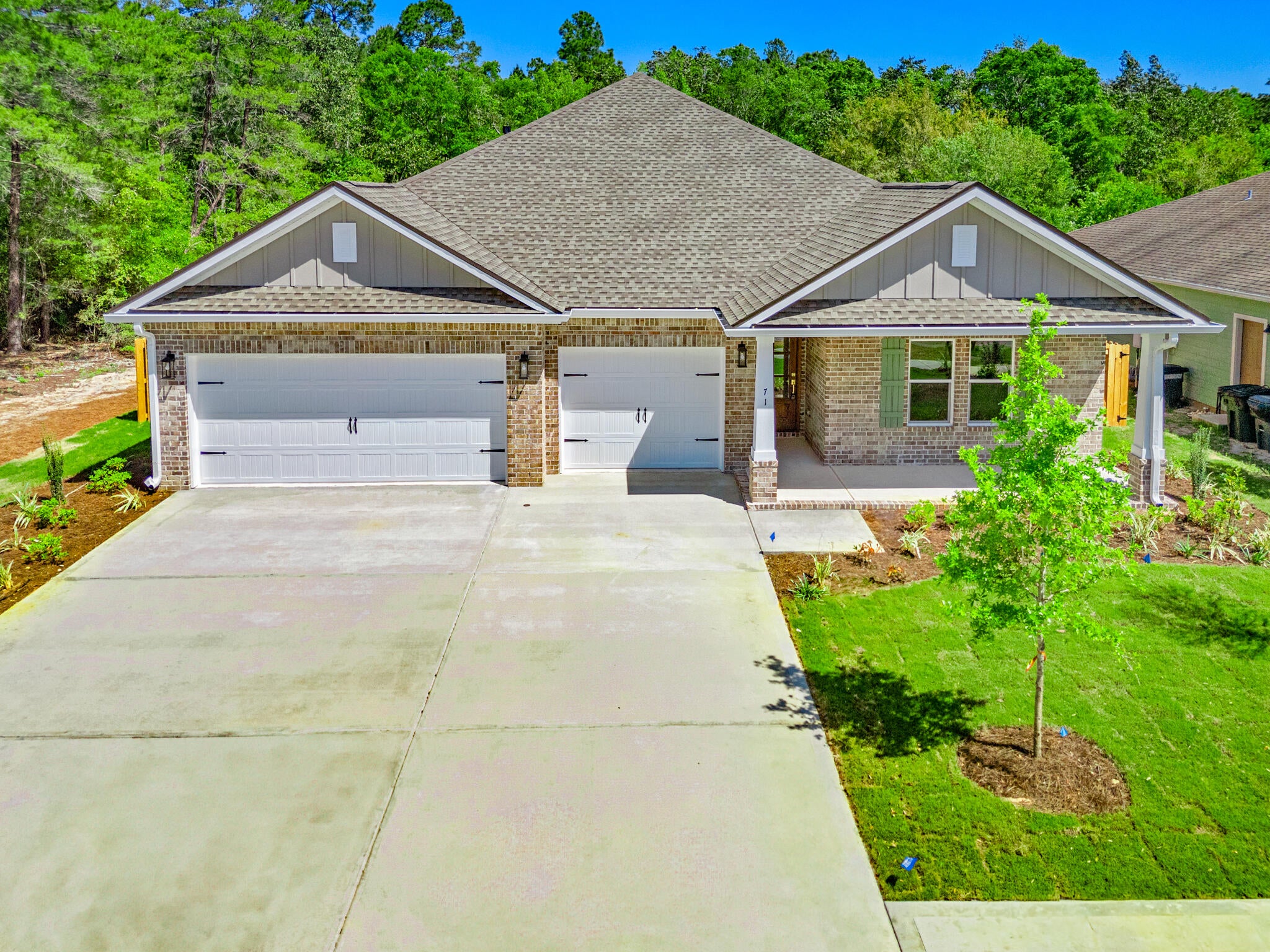 Custom, spacious 5 bdr, 3 bath home. Features include an open concept great room, dining and kitchen, all overlooking the backyard and nature preserve. Spacious MBDR and bath w/a walk in shower and separate soaking tub. Laundry w/sink. A 3 car garage-w/ attic access for storage, 10' ceilings, w/12' ceiling in great room and mbdr. Custom soft close cabinetry w/Quartz countertops, 7' crown molding, tile and LVP flooring (no carpet) tankless water heater, ceiling fans, window blinds and more! Professionally landscaped w/sprinkler system and well. Gutters and a 6' high privacy fence w/gate already in place.  (Features List is inc. in the document section.) This exceptional community offers access to the extensive array of Hammock Bay amenities