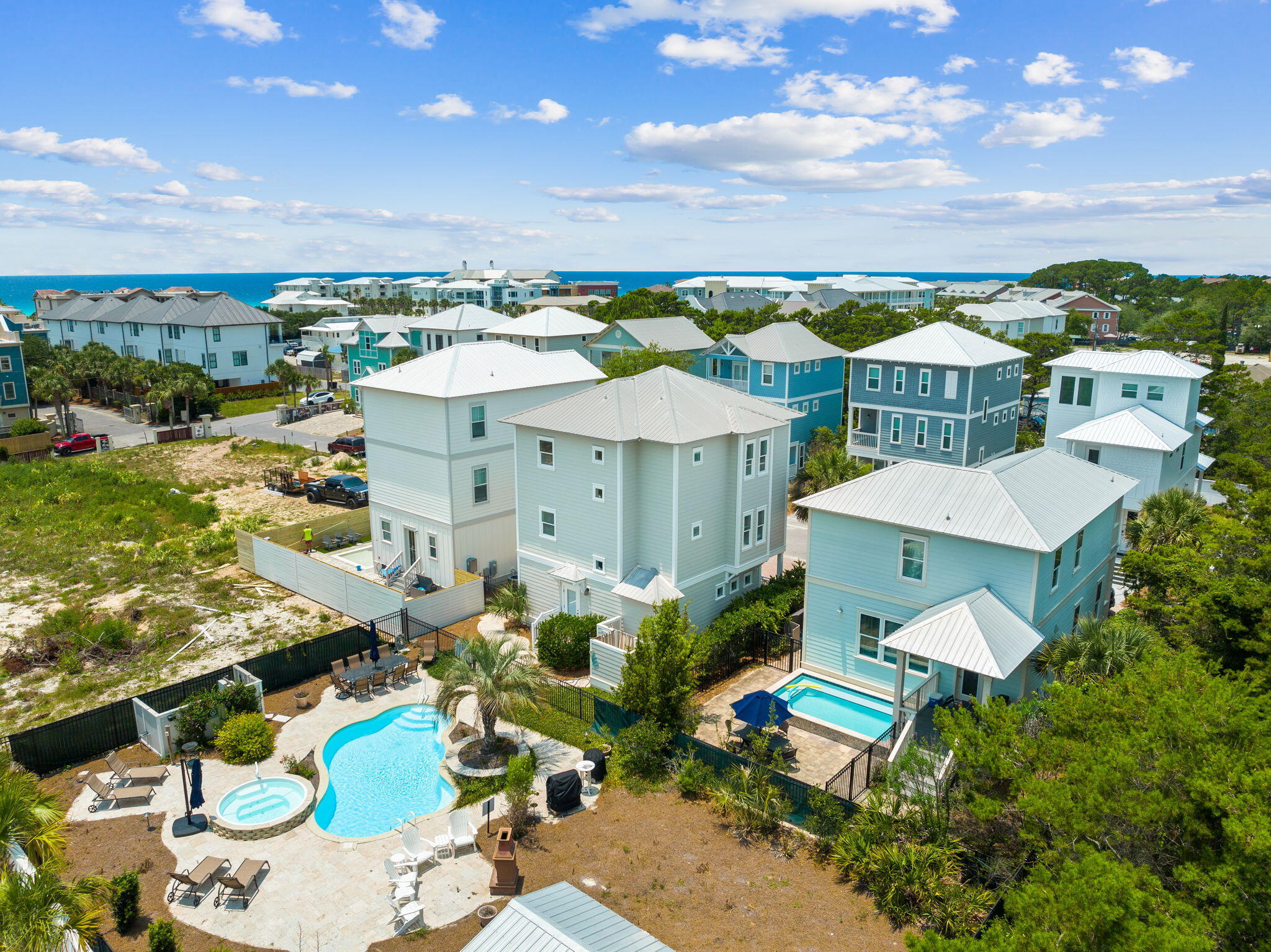 ''Follow the Sun'' at 54 Abbey Road is the kind of opportunity that defines a market -- an irreplaceable 30A property that savvy buyers wait years to find! Did I mention, No HOA Fees?. Perfectly positioned on one of the highest elevations near the Gulf and spanning nearly a quarter-acre across two combined lots, this estate offers a rare blend of privacy, scale, and untapped potential just moments from the sand. A short walk or effortless golf cart ride delivers you to Ed Walline Beach Access, while at home, a true resort experience unfolds. The expansive grounds showcase one of the largest full-size pools and hot tubs in the area, complemented by a cabana, outdoor fireplace, gas grill, and an outdoor shower with private dressing area--crafted for unforgettable luxury stays and elevated entertaining. Already a proven rental powerhouse, the real advantage lies in what comes next. The oversized dual-lot footprint may allow for a guest house, second income-producing residence, or custom garage, with rear easement access in place and possible re-division for future resale strategies. All subject to county regulations, of course! Opportunities with this level of location, land, and income potential are exceptionally rare--making this not just a purchase, but a strategic acquisition poised for immediate returns and long-term appreciation.