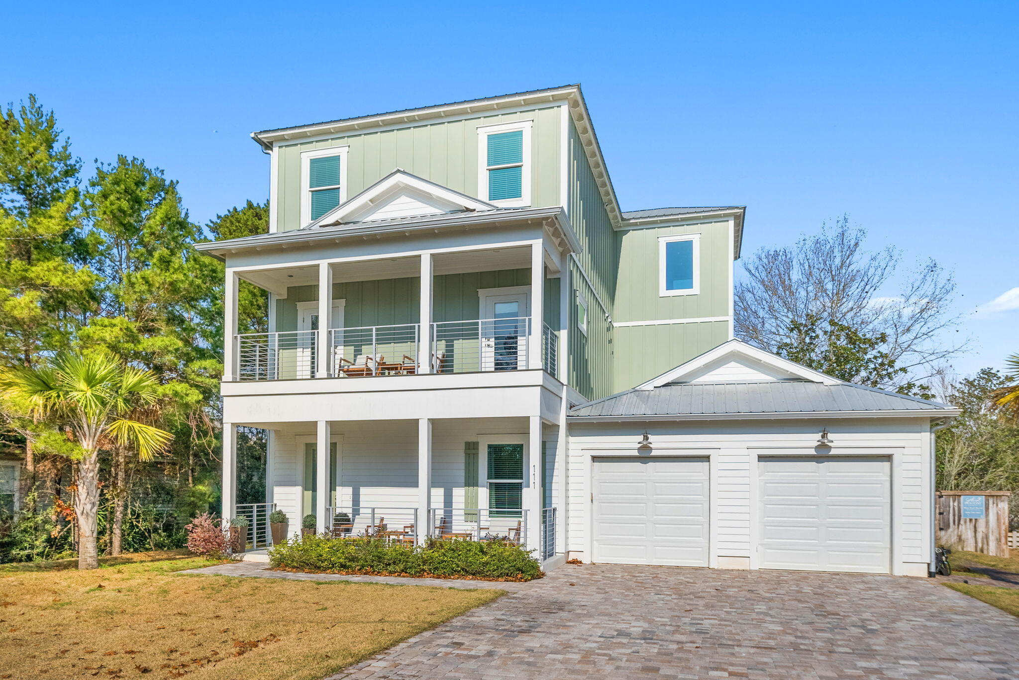 With proven rental numbers come and experience modern coastal elegance at 111 Walnut St., a masterfully crafted 3-story residence boasting 6 bedrooms, 4.5 bathrooms, and 3,503 sq. ft. of upscale living space on a prominent corner lot with no HOA. Designed for effortless entertaining, the home features high ceilings, a chef's kitchen equipped with quartz countertops and a massive breakfast bar, multiply living spaces, and plenty of porches on all levels. Outdoor living shines with a private pool, gas fire pit, and a fenced yard. Complete with an oversized 3-car garage giving you ample amount of room for your vehicle, golf cart, bikes and beach chairs. You're just moments from Gulfview Heights Beach Access and the dining of Gulf Place.