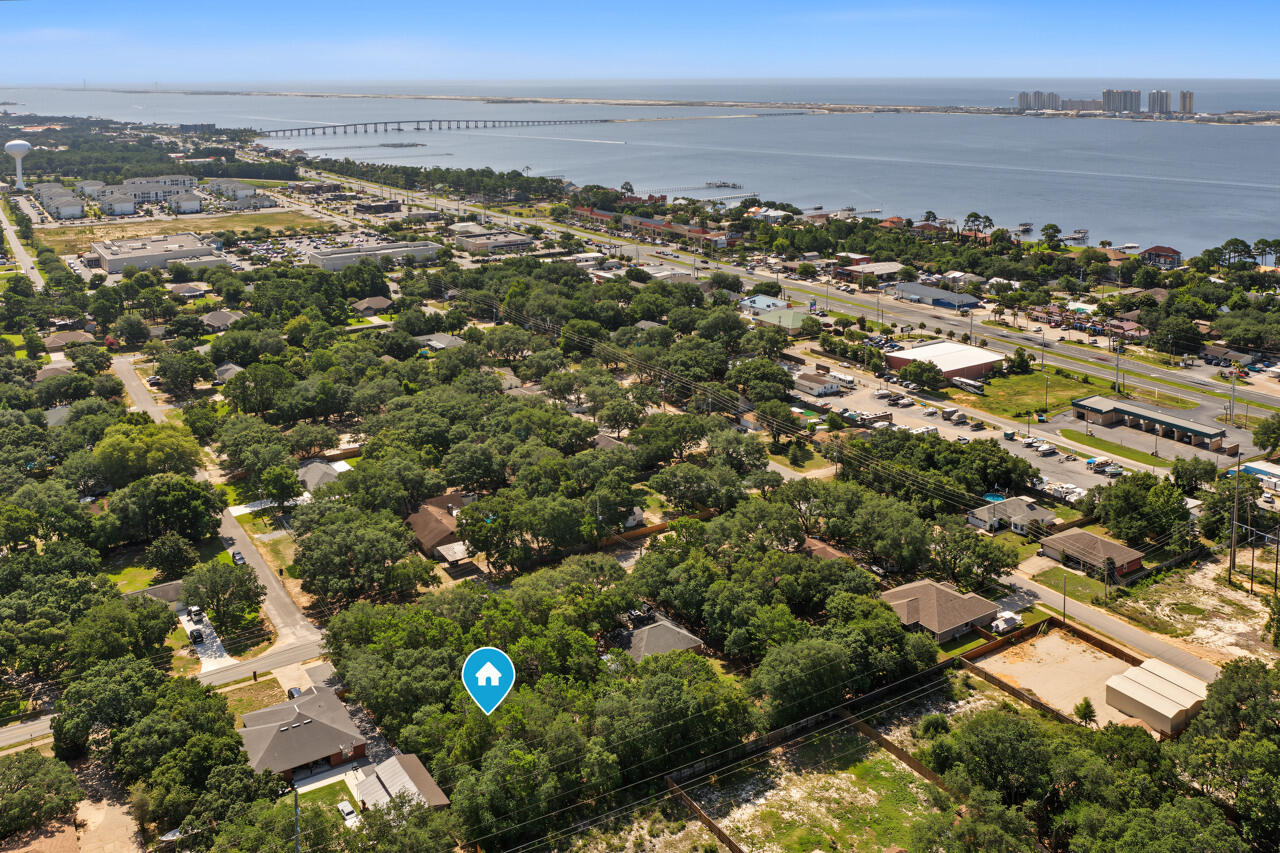 Build your dream home on this oversized vacant lot. Located just minutes from schools, shopping, dining, military bases, and the beautiful white-sand beaches of Navarre Beach, this property offers both convenience and opportunity.