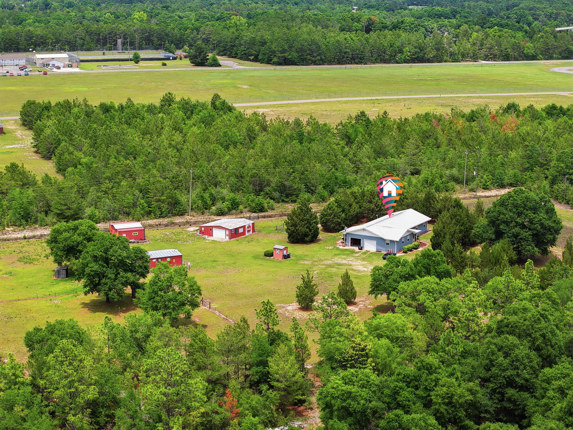 Hobby Farm Retreat -- Live the Self-Sufficient Lifestyle. Just minutes from town! This beautiful 5-acre hobby farm is fully fenced and cross-fenced, making it ideal for livestock, gardening, and sustainable living. Raise your own vegetables, chickens, and beef The property features multiple garden areas, lush pastureland, and an in-ground irrigation system covering nearly 50% of the property. The BR/2BA home is approximately 1,856 SF. with laminate flooring throughout, a smart layout,  Perfect for country living. Outside improvements include: 30x30 main barn, 18x21 hay barn, 21x24 chicken coop. Whether you're looking for a peaceful homestead, hobby farm, or a place to enjoy a more sustainable lifestyle, comfort and country charm.  Seller will give a 3000.00 allowance for a new floor in the den and a 10,000 allowance for a kitchen upgrade at closing with a full price offer. 24 hours' notice mandatory to show
