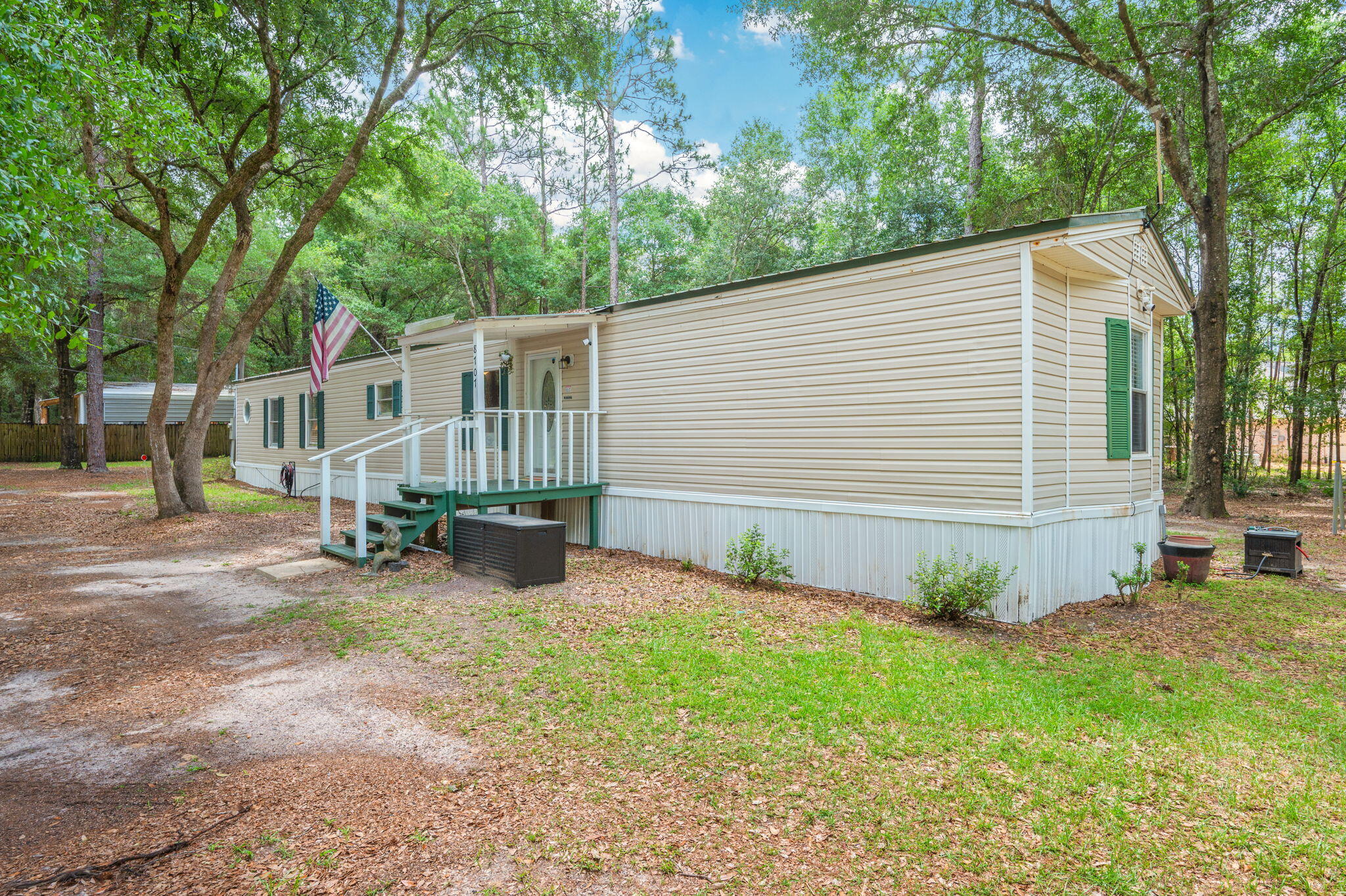 Move right into this thoughtfully updated East Milton home and US-90, available fully furnished if desired! Situated on nearly half an acre with quick access to I-10, this 3-bedroom, 2-bath property offers the perfect combination of modern comforts, country charm, and everyday convenience.

The inviting interior features an updated kitchen with stainless steel appliances, abundant cabinetry, and plenty of storage space. A separate laundry area adds functionality, while a covered back deck, creating the perfect space for outdoor entertaining or relaxing while enjoying the peaceful surroundings.

The spacious primary suite serves as a private retreat, complete with a garden tub, separate shower, and double vanity. Kitchen appliances, washer, and dryer all convey with the sale.

Outside, you'll find a storage shed with power.
