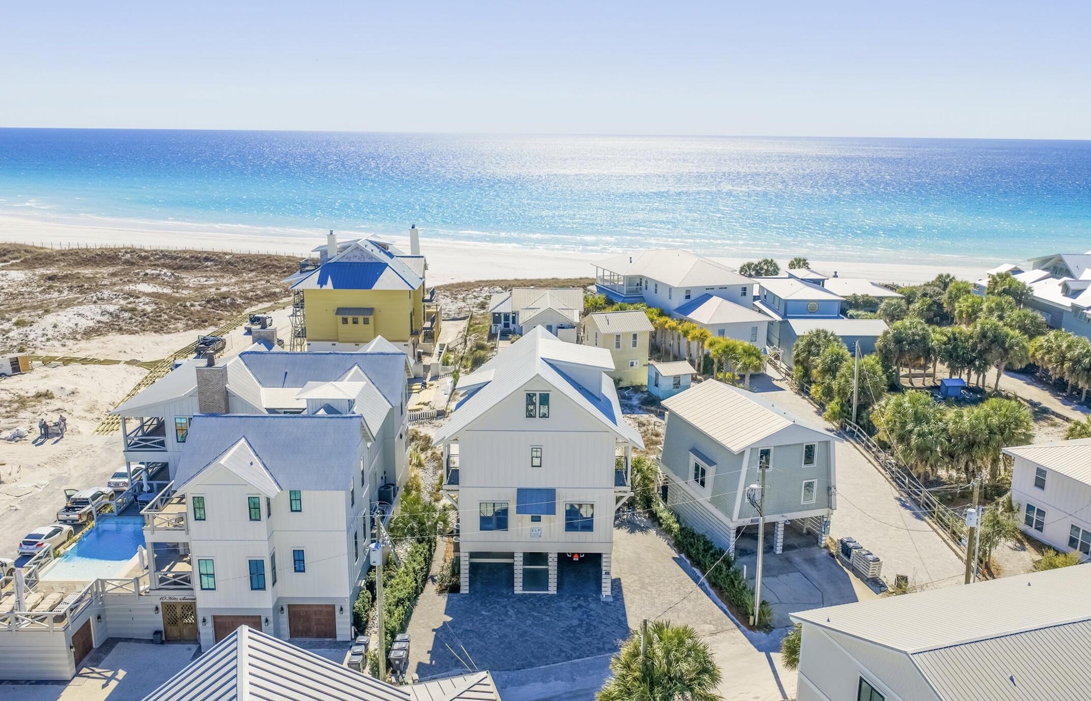 Stunning Home Right on the sand with gorgeous Gulf Views in Grayton Beach!!! This exceptional 7-bedroom coastal retreat also features 2 bonus rooms, offering space and flexibility for large gatherings. Enjoy a large private pool, outdoor kitchen, private elevator, and parking for up to 8 cars--rare for a true beachfront home. Designed for luxury living, the property is turn key, features a dedicated bunk room, and three expansive balconies capturing breathtaking sunsets and stars on clear nights. Located less than 350' from The Red Bar and Chiringo, with a boat launch to place in a kayak or paddle board into Western Lake at the end of the street. Fully furnished and turnkey, this is effortless Gulf-front living at its finest.