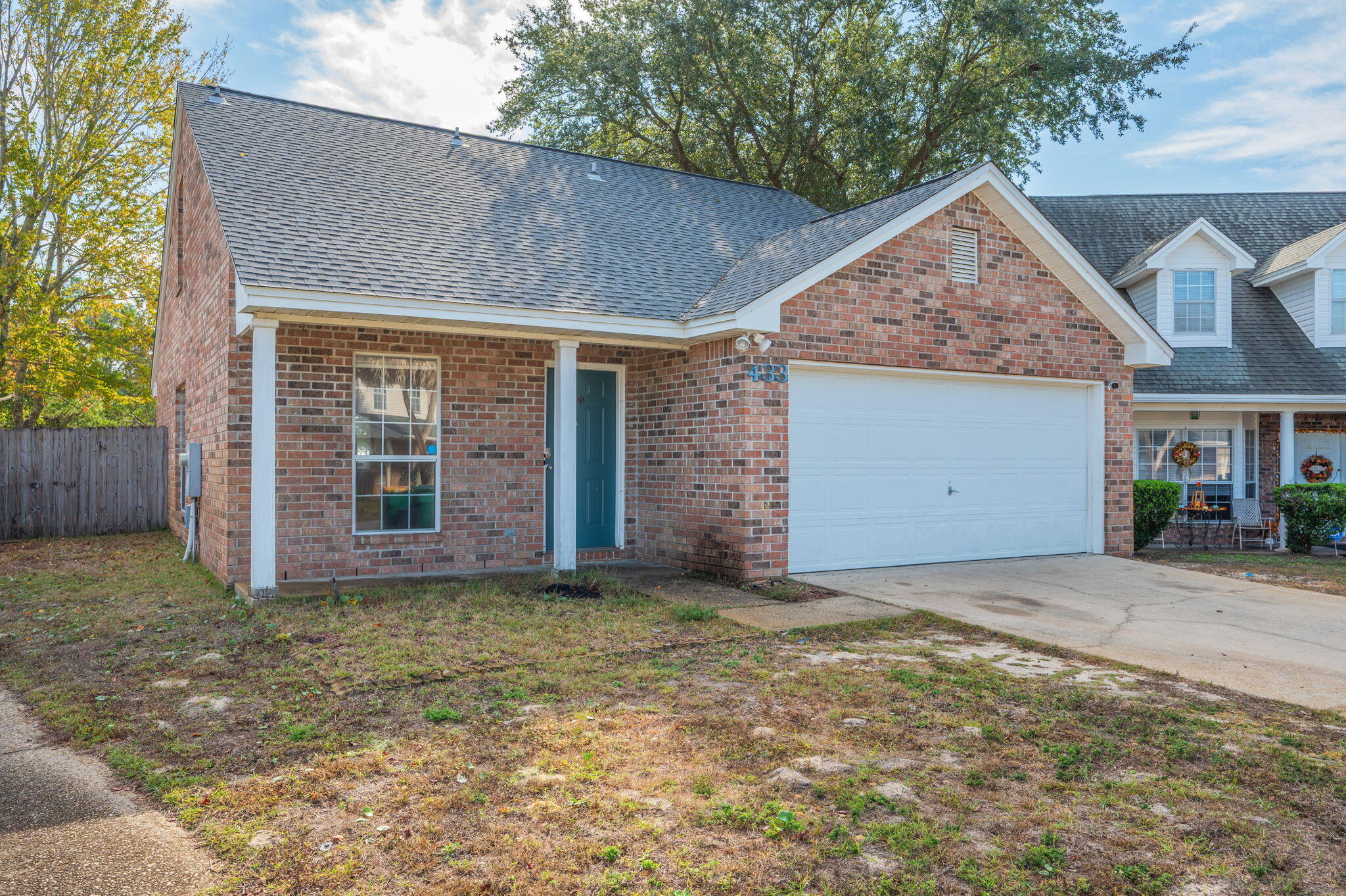 Discover the perfect combination of comfort and coastal living in this charming 3-bedroom, 2.5-bath brick home located on a quiet cul-de-sac in the sought-after Forest Cove community. Conveniently situated just minutes from Hurlburt Field and the breathtaking beaches of the Emerald Coast, this home offers an unbeatable location with a relaxed lifestyle to match. Step inside to a spacious, light-filled living area highlighted by vaulted ceilings and beautiful vinyl flooring that flows effortlessly into the open kitchen and dining space, ideal for entertaining guests or enjoying cozy nights at home. The kitchen is designed for both function and style, featuring a breakfast bar, pantry, and direct access to the private backyard patio -- perfect for morning coffee, outdoor gatherings, or summer cookouts. The primary suite is located on the main floor, offering added privacy and comfort with its walk in closet and spacious en suite bathroom. Upstairs you will find two additional bedrooms and a full bath, providing a great separation of space for kids, guests, or a home office.
One of the standout features of this home is the private neighborhood walkway that leads directly to Florosa Elementary School. There is no need for major road crossings or long car lines, and the convenient access offers total peace of mind. A wooded buffer behind the fenced backyard adds privacy and a quiet, natural backdrop.