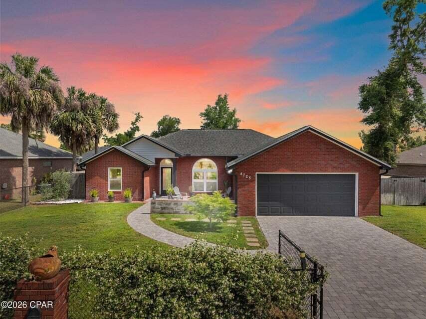 Welcome to 4725 Halcyon Dr. -- a beautiful three-bedroom, two-bath all-brick home tucked away on a quiet street, just a short walk from the boat landing at Deer Point Lake. Fully renovated down to the studs in 2019, this home feels brand new, featuring all-new upgrades including a 30-year dimensional shingle roof, insulation, sheetrock, flooring, HVAC system, hot water heater, windows, kitchen and appliances, sleek black gutters, plumbing and lighting fixtures, and fresh paint throughout.

As you step through the private front gate, you'll be greeted by the fragrant Jasmine Evergreen climbing the fence, adding charm and character to the property. The spacious paver driveway leads to a two-car garage. Inside, you'll find luxury vinyl plank flooring throughout and a modern kitchen that boasts soft-close cabinetry, floating shelves, white subway tile backsplash, quartz countertops, and high-end appliances--including a white refrigerator less than a year old.

The living room features a fully operational wood-burning fireplace that can also be used as an electric heat source, perfect for cozy winter evenings. The primary bedroom is bright and generously sized, offering serene views of the private backyard. The primary bath includes a double vanity and a walk-in closet. With a split floor plan, both bathrooms have been completely updated with matching quartz countertops and custom cabinetry.

Step outside to a large screened and covered back porch, a fully fenced backyard for ultimate privacy, and even a chicken coop. With no HOA, you're free to park your RV or boat on-site. Located in Flood Zone X, flood insurance is not required.

This home is the perfect blend of comfort, privacy, and modern living--schedule your private showing today.