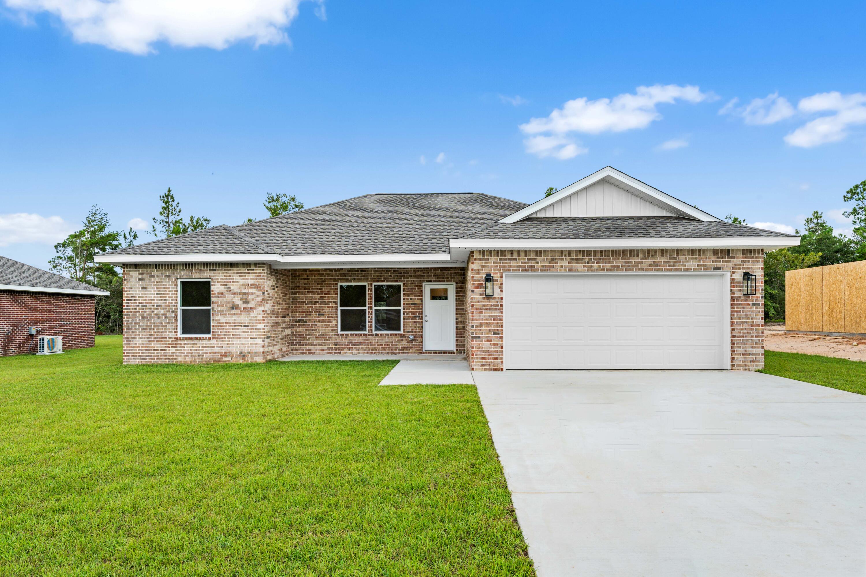 Construction complete!  Ready to move in. This thoughtfully designed 3-bedroom, 2-bathroom residence features a brick exterior with 2,168 under roof and 1,468 s.f. heated/cool living space.  Front and rear porches and full size 2 car garage.  The home features LVP (luxury vinyl plank) flooring throughout with tile in the bathrooms (both with tubs).  All wood, self closing, two tone cabinetry accents the open concept living and kitchen area with beautiful quartz counter tops and 93x36 island.  You'll love and enjoy the convenience of the laundry room being located accessible to the spacious private  Primary bedroom ensuite.  Two bedrooms are on the other side of the kitchen and living area with Jack and Jill bathroom.  
Ask about Builder credits and incentives that can help fund closing costs and buy downs.