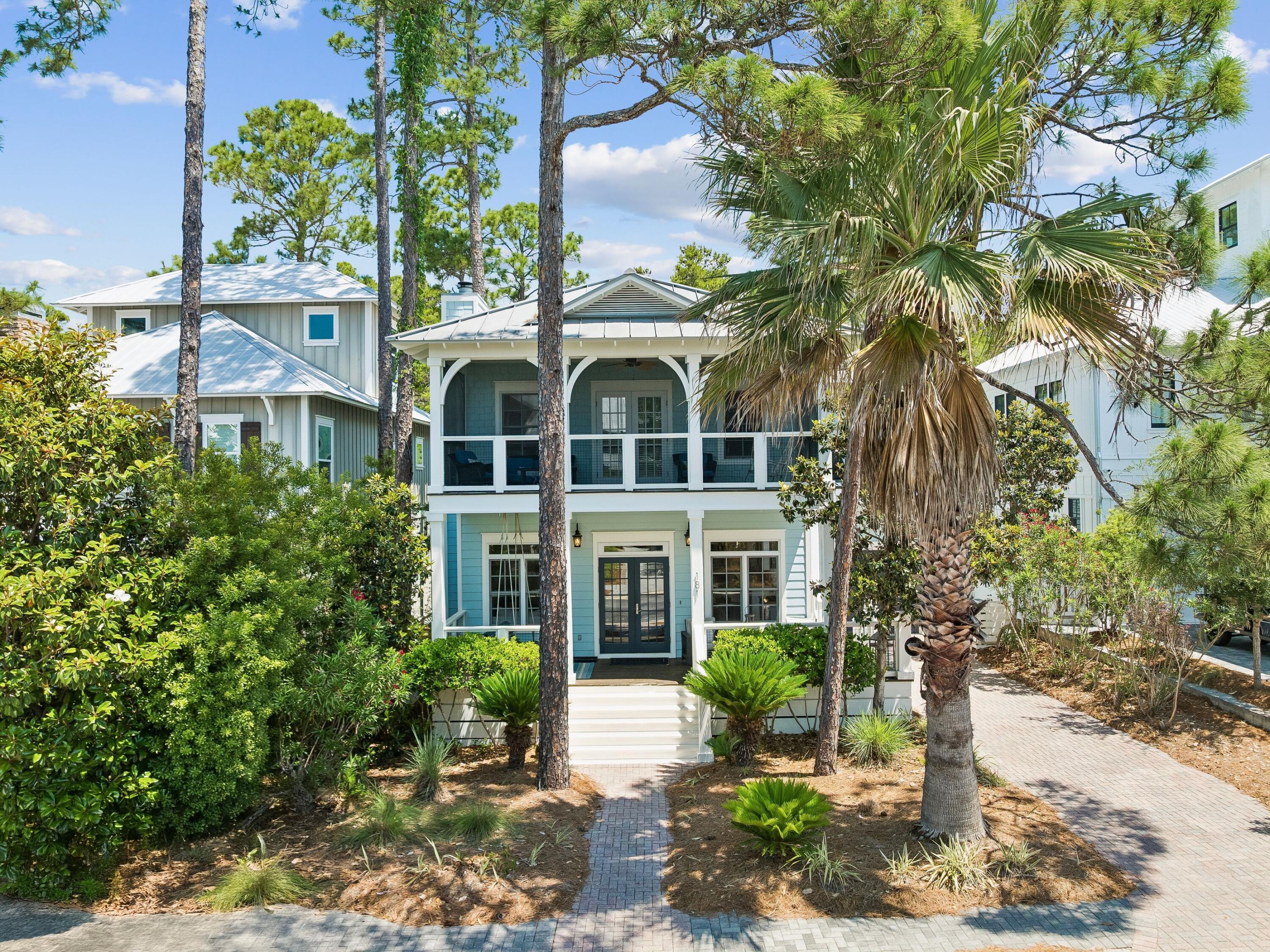 Set against the quiet backdrop of Point Washington State Forest, this beautifully updated Florida cottage offers a polished coastal retreat with room to gather, unwind and enjoy the best of 30A's west end. With five bedrooms, three full and two half baths, the home is well-suited for full-time living, a second home, or a short-term rental investment.

Thoughtful renovations bring a fresh, elevated feel throughout the interiors. The remodeled kitchen features new custom cabinetry, stainless steel appliances, quartz countertops and a stylish tile backsplash, while new flooring, updated baths and fresh paint create a bright, inviting atmosphere. Two primary suites, including one on the main level and one upstairs, offer flexibility for guests, family or multi-generational living.

Outdoor living is a natural extension of the home, with private porches on both levels, mature landscaping and peaceful forest views. A newly screened upstairs porch creates a comfortable place to enjoy the coastal breeze.  Above the garage, a bonus room with its own half bath offers additional space for a home office, media room or overflow accommodations.

Residents enjoy access to a community pool, clubhouse and park, all within easy reach of public beach access, local dining, shops, hiking trails and bike paths. With Blue Mountain Beach, Grayton Beach and Seaside, Florida, nearby, this refreshed coastal cottage pairs privacy, convenience and classic 30A living in one inviting setting.