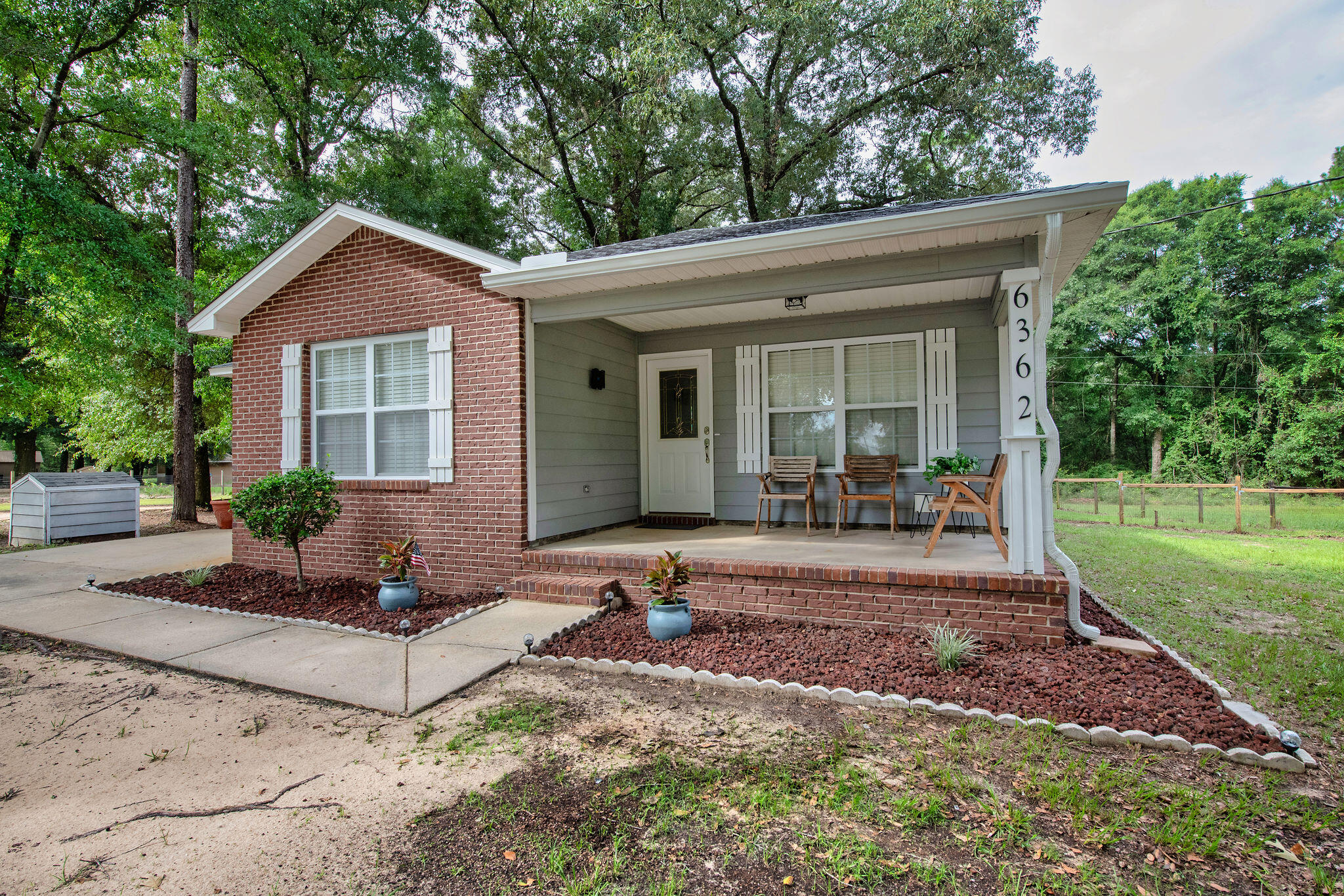 The very definition of ''turn key''! This beautiful Baker home is a rare find. Located om Old River Road this three bedroom, two bath all brick home gives the feeling of being in a county setting while being only 11 miles to downtown Crestview. The home is situated on an expansive 1.19 acre lot and shaded with large, mature trees. The backyard is fully fenced and features a nice deck for outdoor recreation. Inside the home are genuine hardwood floors, all new door hardware, light fixtures, bathroom fixtures, new Levelor blinds, new smoke detectors and new paint. For peace of mind (and reduced insurance rates) the water heater is brand new, roof is 2 years old, HVAC replaced 2025 ,appliances are less than 4 years old,, septic was pumped in 2025 and the well has been serviced! Outside, the gutters are screened for low maintenance. Literally the only thing to do is move in!  Schedule your showing today.
