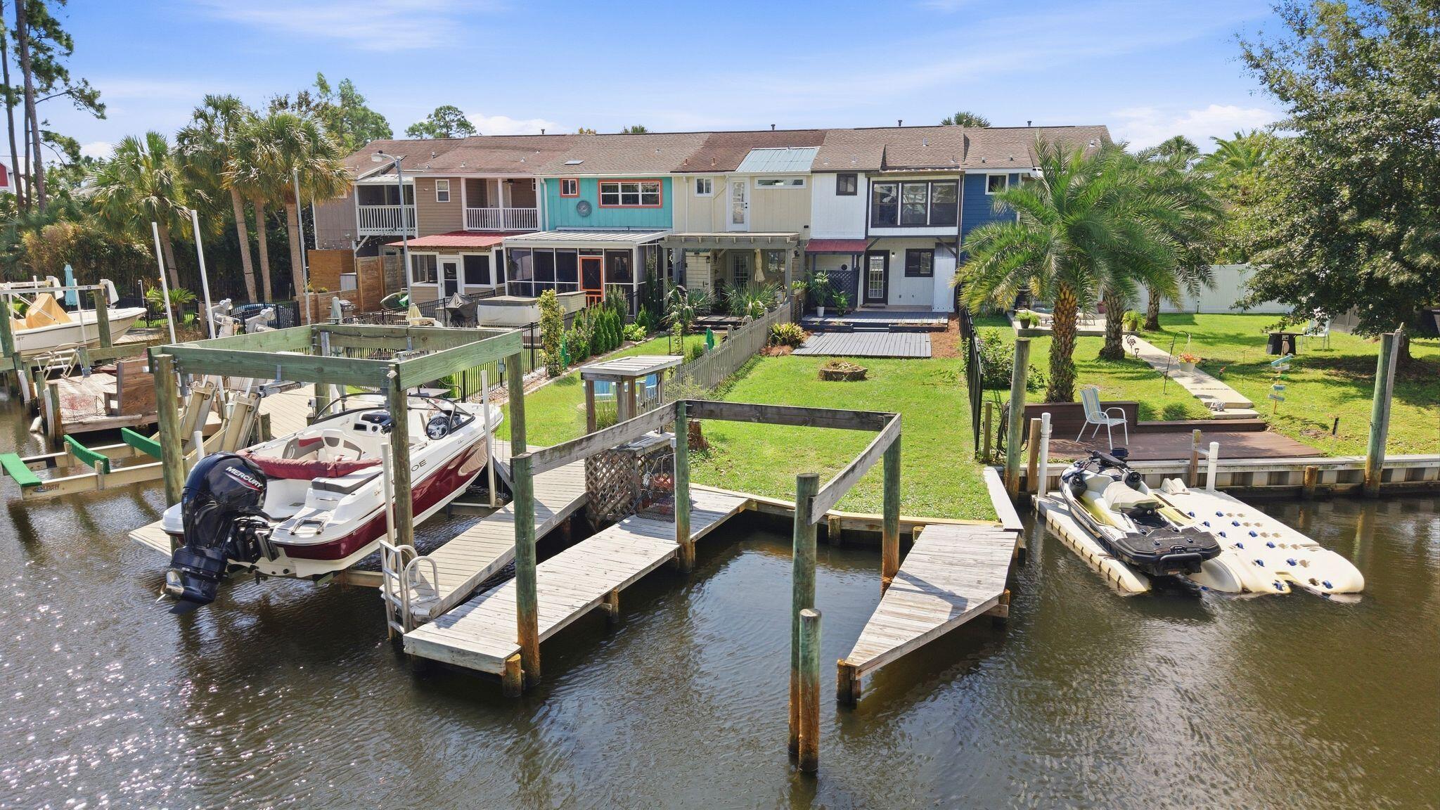 WATERFRONT LIVING IN PANAMA CITY BEACH UNDER $325K! Welcome to 6532 Harbour Boulevard, a canal-front townhome offering the coastal lifestyle buyers are looking for at an approachable price point. Located in the gated Harbour Towne community, this 2-bedroom, 2.5-bath home features a bonus space overlooking the canal, perfect for a home office, reading nook or additional sitting area. Step outside to your waterfront patio and backyard overlooking the canal, where you can hop on the boat and spend the day cruising the bay, fishing, or venture out to the Gulf for a day on the water. A BRAND-NEW ROOF adds even more value and peace of mind for the next owner. Harbour Towne offers an impressive lineup of community amenities including two pools, pickleball courts, tennis courts and a community center, with Bayside Marina nearby. Conveniently located in Panama City Beach with easy access to the beaches, shopping, dining and surrounding areas, this property offers the best of both waterfront living and everyday convenience. Whether you're searching for a primary residence, second home or your own Panama City Beach getaway, this is an opportunity to enjoy canal-front living without the typical waterfront price tag. Schedule your private showing and come see what makes this waterfront townhome special!