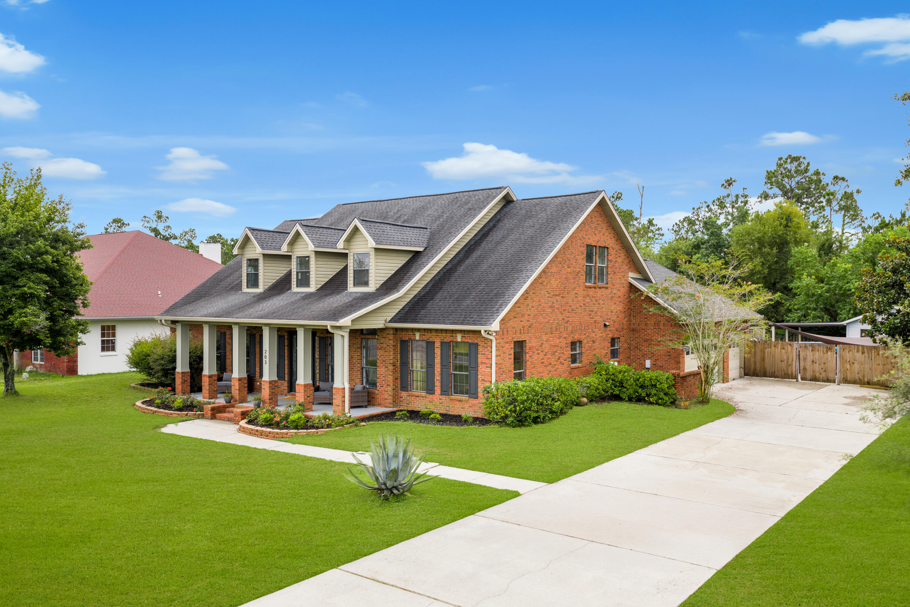 Hidden on one of College Point's most private and rarely traveled streets, 203 Judy Circle offers an exceptional blend of space, privacy, and coastal lifestyle. Many locals don't even realize this street exists, making it a true hidden pocket within one of Bay County's most desirable neighborhoods. This 5-bedroom, 3-bath Craftsman-style brick home features 4,578 square feet of heated and cooled living space on a spacious, fenced lot backing to open green space. The thoughtfully designed layout includes soaring ceilings, oversized rooms, and generous closets throughout. Interior features include crown molding, terrazzo and vinyl plank flooring, recessed lighting, a chef-style kitchen with large island and walk-in pantry, a gas fireplace, and a dedicated media room. An expansive upstairs family or recreation room provides flexible living space. The cooled sunroom provides highly versatile space that can function as a playroom, homeschool classroom, second living area, home gym, office, or game room, with natural light and backyard views. Outdoor amenities include a private pool with custom decking, fire-pit area, outdoor shower, and a detached shed/workshop offering excellent storage or hobby space. An oversized driveway and 3-car garage provide ample parking for vehicles, boats, or golf carts. No HOA. Located in College Point, this home offers convenient access to the bay-front park, walking trails, playgrounds, schools, and community events, capturing the relaxed coastal lifestyle this area is known for while remaining close to shopping and dining. Homes offering this level of privacy, square footage, and outdoor living in College Point are rarely available.