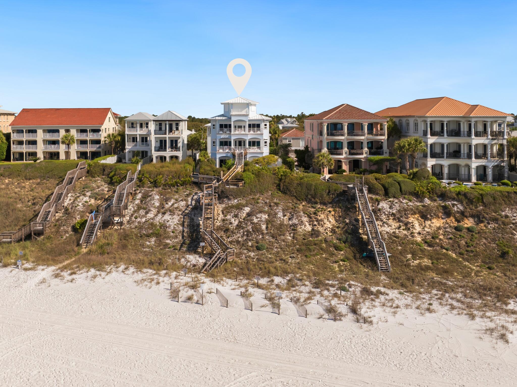 Positioned directly on Scenic Highway 30A, this exceptional Gulf-front property offers 68.3 feet of private beachfront and sweeping, unobstructed views of the Gulf. With a 325-foot-deep lot, the setting provides a rare combination of depth, privacy, and immediate access to the sand.

The main residence, just under 6,000 square feet, is designed to maximize its premier location, with expansive Gulf-facing living spaces, seamless indoor-outdoor flow, and direct walkout access to your private stretch of beach.

Complementing the main home is a 1,560-square-foot carriage house featuring 2 bedrooms, positioned above a two-car garage. The front portion of the carriage house includes a dedicated office and half bath with a private entrance, offering flexibility for guests, remote work, or additional living space.

Located just minutes from Rosemary Beach and approximately one mile west of Alys Beach, this property combines Gulf-front privacy with convenient access to some of 30A's most sought-after dining, shopping, and lifestyle amenities.

Key Highlights:

- 68.3 linear feet of Gulf frontage
- Private, direct beach access
- Gulf views!
- Lot depth of approximately 325 feet
- Each structure has a 2-car garage
- Prime location along Scenic Highway 30A
