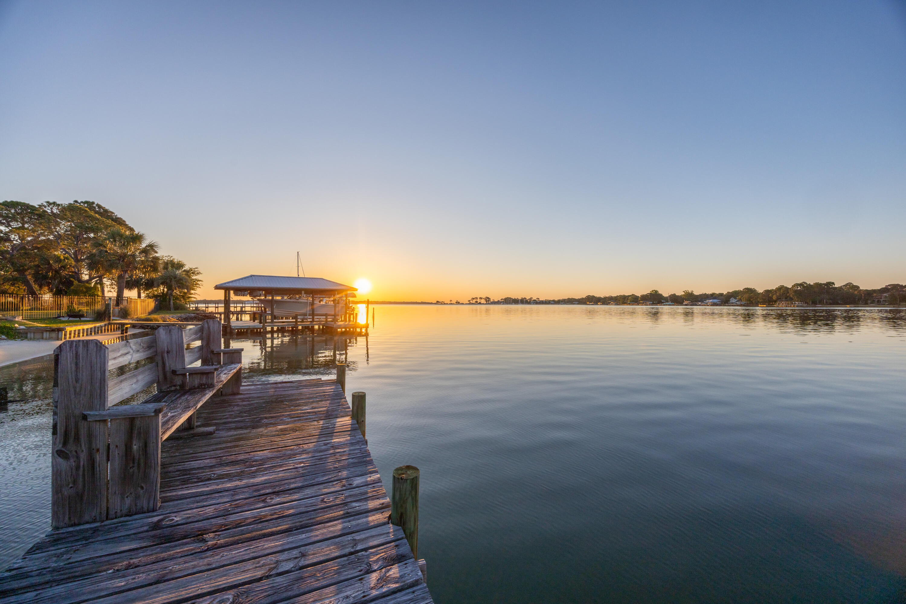 Is there a 4-bedroom waterfront home in Fort Walton Beach with deep water access and Gulf connectivity? 239 Beachview Dr presents a rare opportunity to own a .39-acre deep-water bayfront property with direct access to the Gulf of America via East Pass, offering exceptional potential to remodel or build new in a premier boating location.

This is a compelling opportunity for buyers, builders, and investors seeking a custom waterfront estate, a value-add redevelopment opportunity, or a high-demand short-term rental property. Short-term rentals are allowed, adding flexibility and income potential in a sought-after coastal market. Whether you choose to renovate the existing home or build new, this 4-bedroom waterfront home in Fort Walton Beach stands out as a rare opportunity to secure deep water access, an estate-sized lot, and long-term value.

Situated on Choctawhatchee Bay, 239 Beachview Dr offers a unique combination of existing livable space and long-term development potential on an estate-sized waterfront lot in a protected bayfront setting with unobstructed water views. The home features 4 bedrooms, 2 bathrooms, and 1,658 square feet, including a Florida room that can be reimagined to maximize the waterfront backdrop. The expansive .39-acre lot is the true highlight, presenting a rare bayfront offering with build-ready potential, ideal for those looking to design a custom waterfront estate or create a legacy property. Deep water access supports large vessels and sportfishing boats, with the opportunity to add a private dock tailored to your boating needs.

With direct access to the Gulf of America via East Pass, this location is well suited for offshore boating and deep-sea fishing. From your private sandy shoreline, enjoy captivating sunrises and moonrises that define extraordinary waterfront living. The setting supports a full range of water-based activities including boating, kayaking, jet skiing, paddleboarding, snorkeling, and fishing. Choctawhatchee Bay is widely recognized as a fisherman's delight, with miles of bayous and tributaries extending from the bay, offering diverse fishing environments and year-round opportunity for anglers.

Spend your days kayaking, jet skiing, boating, fishing, or snorkeling, then take your boat across the bay for an evening in Destin Harbor with waterfront dining and entertainment. The outdoor space offers a natural canvas to design your waterfront haven, whether creating a zen-inspired escape, an expansive entertaining area, or a private coastal retreat surrounded by water, wildlife, and open skies.

Deep water access properties like this rarely become available on Choctawhatchee Bay, especially with a .39-acre estate-sized footprint and this level of boating accessibility. This is a location homeowners hold onto, making opportunities to purchase here limited. 

Schedule your private showing to experience the setting, scale, and potential of this waterfront property firsthand.

All information is deemed reliable; however, accuracy should be independently verified by interested parties.