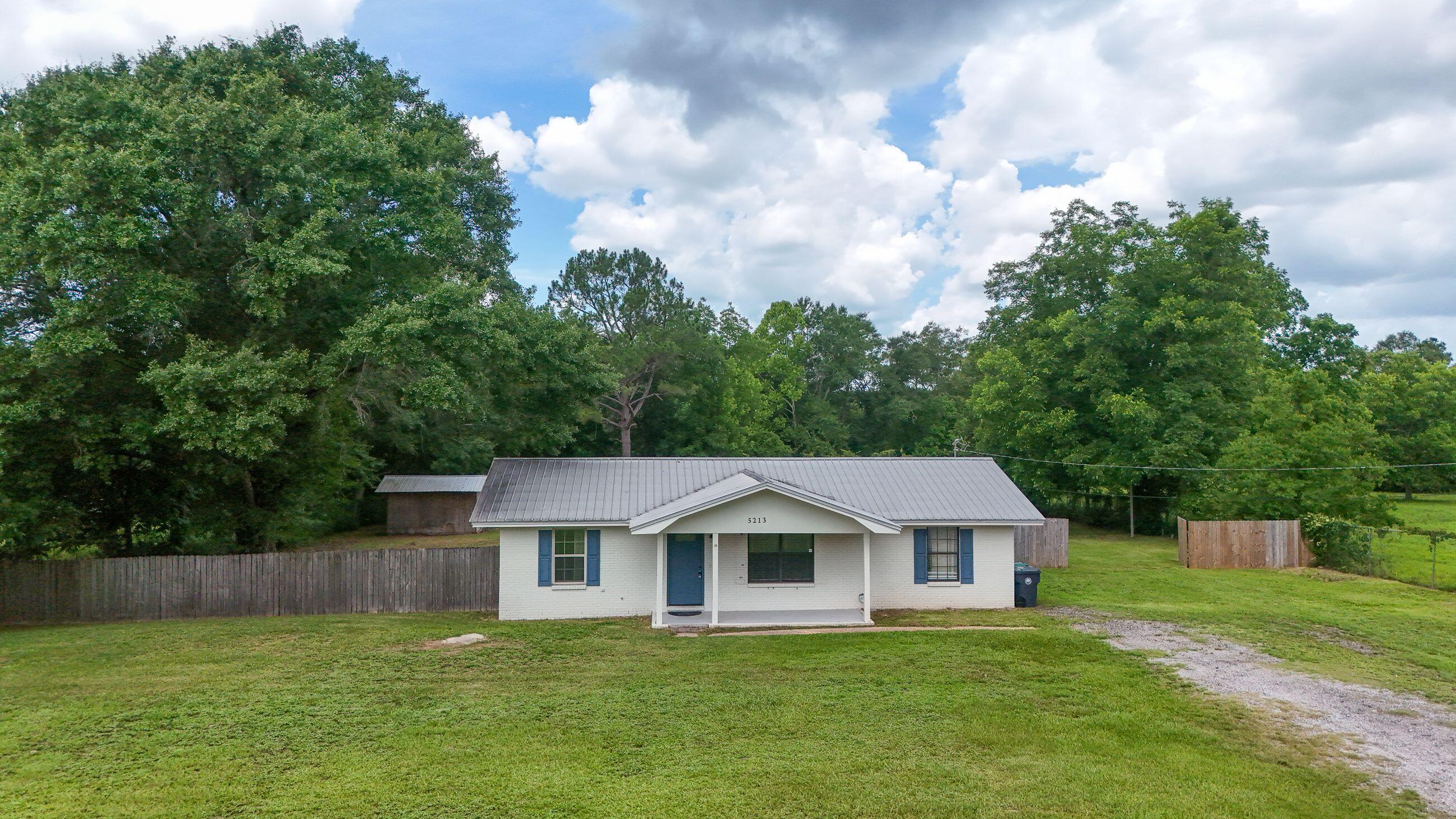 Country living with room to roam! This charming 3-1.5-bath home sits on a beautiful 1-acre parcel in Walton County, offering the perfect blend of privacy and convenience. with 1,196 sq ft of living space, this well-maintained home offers central heating and air, new electrical boxes inside and out, plenty of outdoor space, completely fenced back yard, room for gardening and recreational vehicles. This home is just a short trip to shopping, dining or our beautiful beaches. Schedule your showing today.