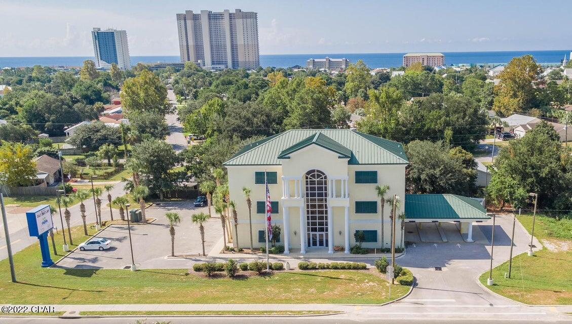 Premier location! Previously the first floor was occupied as a bank and may be up and operational within a 45 day period. The second and third floors have additional office spaces to generate income. Each of the 3 floors are 4000 sq ft. 
The property has an additional lot, parcel id # 33478-010-000 that is included in the sale for parking or enough space to build a 4000 sq ft  building to increase property income. The location is premieer as it is located between Hwy 79 on Hwy 98  close to Pier Park, The City Hall and other valuable ameneties.