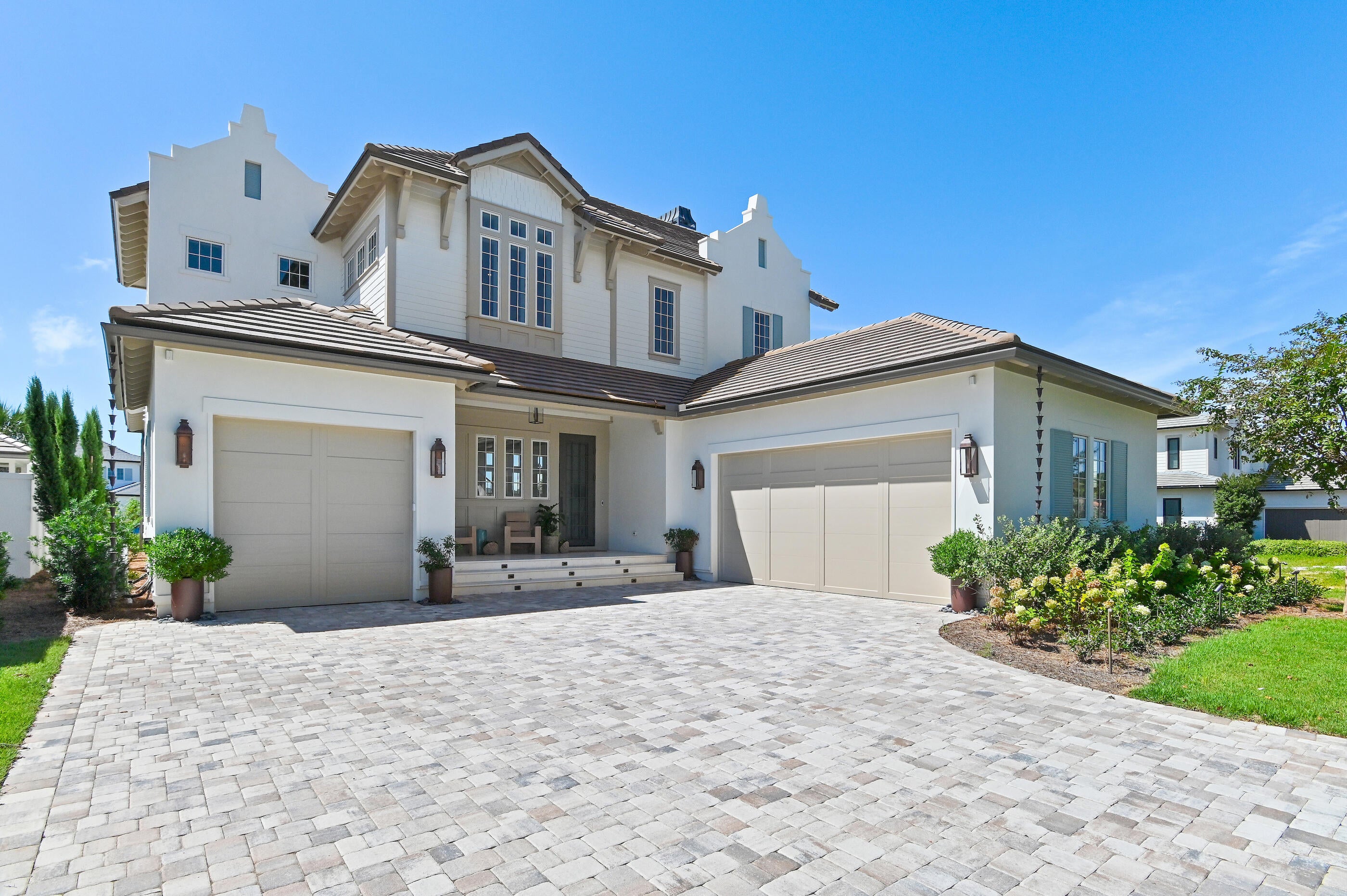 Set within the gated Regatta Bay community in Destin, Florida, this residence is designed around the way life is lived here: with a private pool, outdoor kitchen, first-floor primary retreat, generous guest accommodations and multiple spaces for gathering. Regatta Bay brings golf, boating, dining, shopping and time outdoors into the rhythm of everyday life, with Destin Commons, Whole Foods and nearby restaurants just beyond the gates, and the Regatta Bay Golf & Yacht Club, marina and community recreation close at hand. The community's familiar refrain still captures the appeal: ''Live, Shop, Dine, Play. Never Leave Regatta Bay.'' A clay tile roof gives the home a timeless coastal presence, while inside, paneled walls at the entry introduce an interior defined by craftsmanship and scale. Tall ceilings, hardwood floors and custom tile continue throughout, creating a sense of warmth and permanence without feeling overly formal. In the main living room, exposed ceiling beams add architectural dimension while a gas fireplace creates a natural gathering point at the center of the home.

The kitchen carries that same balance of form and function. A gas range, illuminated glass-front cabinetry and custom tile backsplash bring character to the space, while a butler's pantry provides valuable storage and preparation space away from the main kitchen. Near the dining area, a dedicated wet bar with refrigerator and ice maker keeps entertaining effortless and allows drinks and conversation to flow without interrupting the kitchen.

The first-floor primary suite is intentionally removed from the secondary bedrooms, giving it the privacy and quiet of a true retreat. A generous closet with built-in dressers reinforces the feeling of a suite designed for long-term living rather than simply an oversized bedroom. Custom tile continues into the baths, including a distinctive powder room near the entry, while a dedicated laundry room with sink adds another layer of practical ease.

Upstairs, the home shifts naturally into a private guest and family level. A second living room creates another place to gather, relax or spread out, while an additional wet bar with refrigerator and sink allows the space to function independently from the main level. Three bedroom suites are located upstairs, each with its own full bath, along with a separate half bath serving the shared living space. Balconies off the upstairs bedrooms extend the experience outdoors and provide quiet places to enjoy the Regatta Bay setting.

Outside, the heated private pool becomes the natural center of life at home. A built-in barbecue grill, sink and refrigerator create a true outdoor entertaining space where afternoons by the pool can move easily into dinner and evenings outside. Whether the house is quiet or filled with guests, the outdoor environment feels like an extension of the interiors rather than a separate amenity.

That sense of ease is what makes Regatta Bay particularly distinctive within Destin. The community was designed around the idea that much of the lifestyle people come to Northwest Florida to enjoy can happen close to home. Golf, boating, clubhouse dining and recreation are part of the Regatta Bay experience, while the marina connects life in the community to the waters of Choctawhatchee Bay. Destin Commons, restaurants, shopping and everyday conveniences are immediately nearby, and the Gulf of Mexico and the beaches of Destin remain within easy reach.

It is a place where a day can begin with a round of golf, move to the marina or an afternoon on the water, continue with dinner or shopping at Destin Commons and end back home beside your own pool. The long-standing Regatta Bay philosophy, "Live, Shop, Dine, Play. Never Leave Regatta Bay," still captures what makes the community compelling: not isolation from Destin, but exceptional access to so much of what defines it.

For buyers searching for a luxury home in Regatta Bay, a gated Destin residence with a private pool and outdoor kitchen, or a home with a first-floor primary suite and separate ensuite guest accommodations, this property brings those elements together in a way that feels both refined and livable. Its architectural details, multiple entertaining spaces, three-car garage and thoughtful separation between private and gathering areas create a home designed for everyday living, entertaining and extended stays, while its setting in Regatta Bay places golf, boating, dining, shopping and the broader Destin lifestyle just beyond the front door.