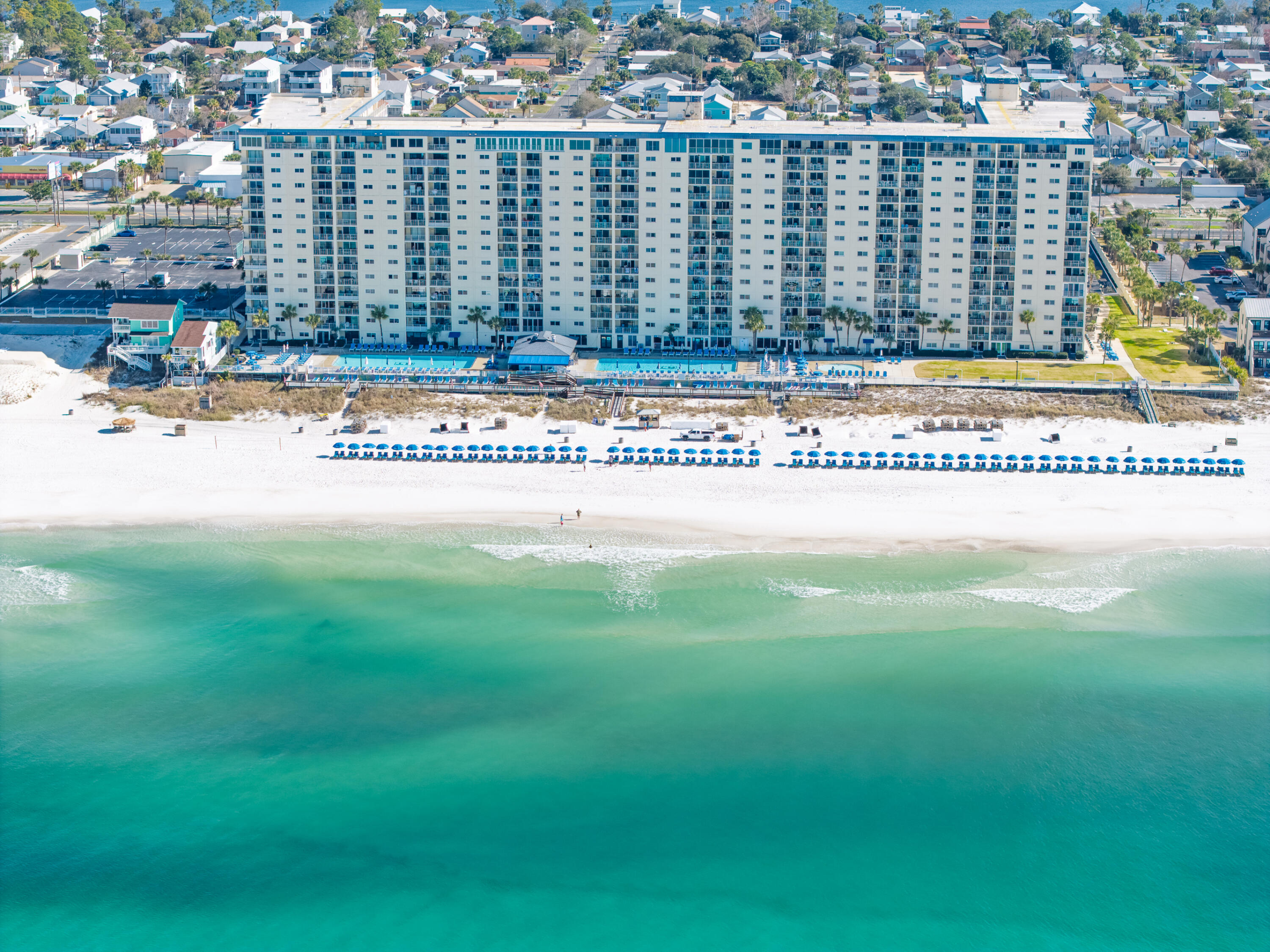 Skip the elevators and step straight into beach life with this 3rd floor end-unit at Regency Towers in Panama City Beach. Located on the desirable west side of the building next to the stairs, this 1-bedroom, 2-bath condo features a corner balcony with a sweeping coastline, plus direct Gulf, pool, and beach views. The additional west-facing living room window fills the space with natural light and showcases stunning sunset vistas.

The condo has been updated with luxury vinyl plank flooring throughout, new bathroom vanities with granite countertops, shiplap accent wall, and a convenient stackable washer and dryer. The primary bedroom offers Gulf views and private balcony access through sliding glass doors.

For over 40 years, Regency Towers has been a very popular beachfront destination, offering gated access with 24-hour security, two beachfront pools (seasonally heated), kids pool, indoor hot tub, fitness center, game room, owner's lounge, picnic and grill area, boardwalk beach access, large green space, and poolside dining at Bikini Bob's.

Ideally located in the South Lagoon area near St. Andrews State Park, Cobra Adventure Park, and local favorites like Schooners and Fin's Island Style Grub, with the exciting new Hadley's Beach luxury development next door.

This condo has primarily been enjoyed by friends and family rather than used as a short-term rental, offering a well-cared-for coastal retreat.