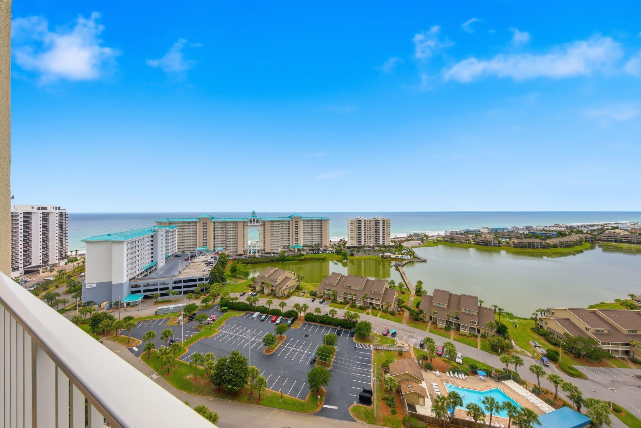 Perched on the 17th floor of Ariel Dunes II, Unit 1709 offers breathtaking, unobstructed Gulf views with panoramic vistas of emerald water and sugar-white sand. This fully furnished, turnkey condo has been extensively renovated throughout, featuring luxury vinyl plank flooring, updated white tile, modern lighting, and designer finishes. The beautifully reimagined primary bath showcases a custom oversized tiled walk-in shower, quartz countertops, updated vanity, and owner's closet. The guest bath has also been tastefully updated with quartz counters, new tub surround, and refreshed finishes. The modernized kitchen features professionally painted cabinetry, a sleek black granite composite sink, and matching black faucet for a clean coastal aesthetic. Designed for maximum rental appeal, the floor plan includes a dedicated bunk room and flexible sleeping arrangements accommodating up to 8 guests. Short-term rentals are permitted, making this an outstanding investment opportunity or personal beach retreat. Resort-style amenities include pools, fitness center, beach access, and ample parking in one of the Emerald Coast's most sought-after destinations.
