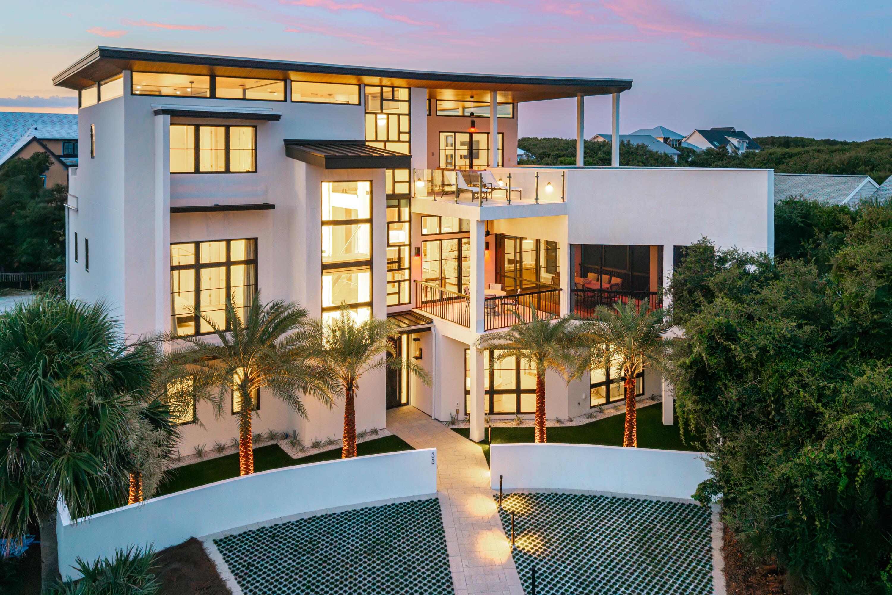 Welcome to 33 Camp Creek Point, an architectural masterpiece where modern luxury meets refined coastal elegance along Florida's iconic 30A. Spanning approximately 6,800 square feet, this extraordinary 5-bedroom, 6 full-bath, and 2 half-bath residence showcases exceptional craftsmanship, sophisticated design, and a remarkable collection of architectural details.

A dramatic three-story floating staircase, gracefully wrapped around a luminous wall of Amberlite glass, creates an unforgettable centerpiece and connects all levels of the home. A soaring three-story, Mondrian-inspired glass wall floods the interiors with natural light, while expansive windows, clean architectural lines, and refined minimalist details create a striking sense of space and sophistication.

The crown jewel is the spectacular third-floor pool, offering sweeping Gulf views and an exceptional setting for relaxation and entertaining. The expansive third-floor living area seamlessly opens to the outdoors, creating a true al fresco experience with breathtaking views stretching from the Gulf to the lake. An impressive outdoor kitchen completes this one-of-a-kind entertaining space.

Every element of this remarkable residence has been thoughtfully designed to inspire and impress. With architectural features and luxurious details too numerous to fully capture, 33 Camp Creek Point is a home that must be experienced in person. Schedule your private showing today and discover this extraordinary 30A masterpiece.