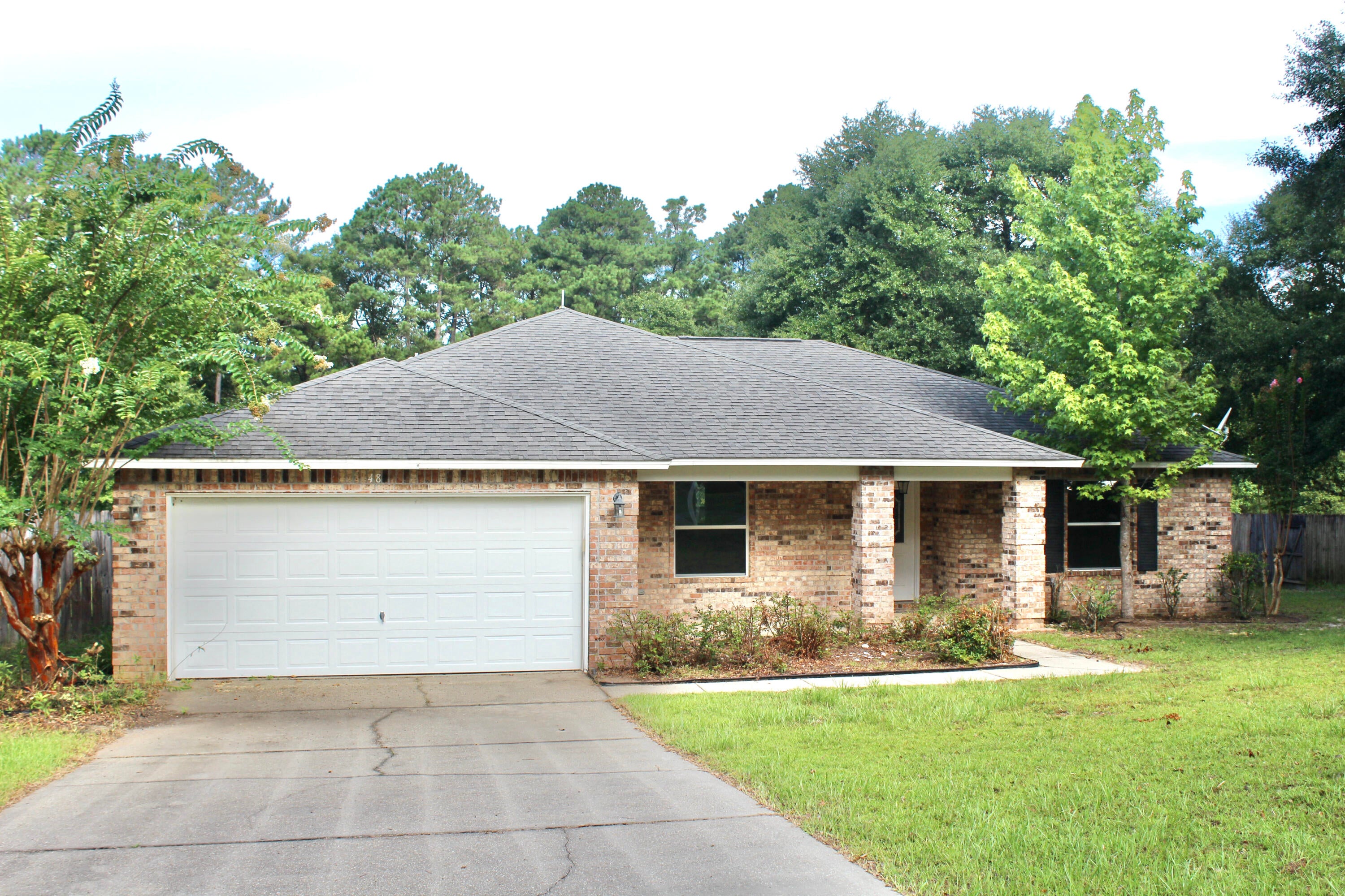Tucked in the peaceful Pleasant Ridge subdivision, this 1,832 sq ft brick home offers a gated community feel with one way in and out—quiet, safe, and serene. The seller has thoughtfully updated the home prior to listing with all new appliances, new flooring, and fresh paint throughout. Move-in ready and shining with pride of ownership, this home features a 2-car attached garage and a spacious layout that's hard to match in this price range. Just minutes from major shopping and historic downtown DeFuniak Springs. Easy to show—call now before it's gone!