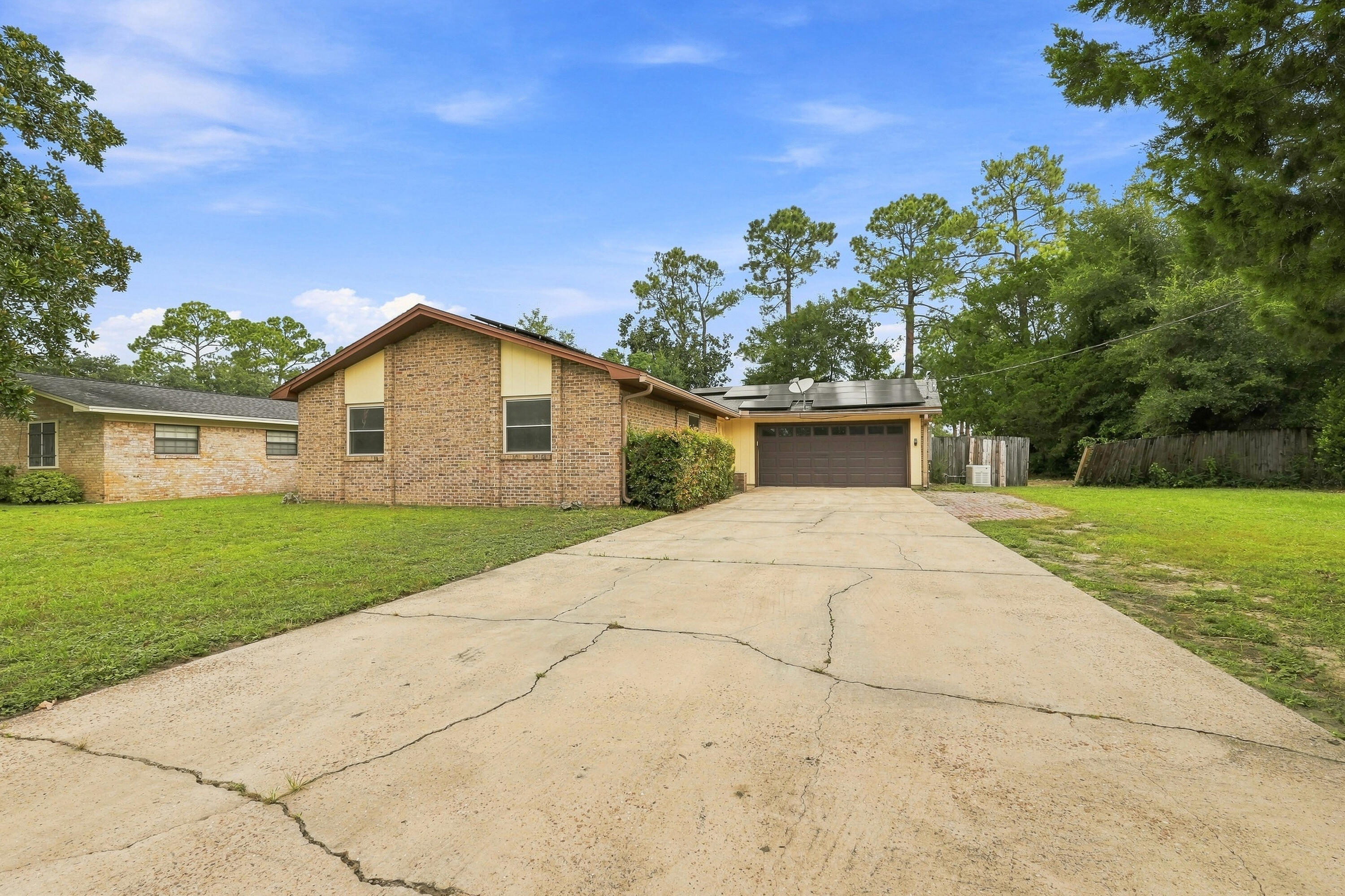 Welcome to 822 Valparaiso Blvd--an excellent opportunity to own a 3-bedroom, 2-bath home in South Niceville for $295,000! Situated on a spacious lot with generously sized front and back yards, this home offers plenty of room both inside and out, along with several valuable upgrades already in place.

As you arrive, you'll appreciate the extended oversized driveway and attached 2-car garage, featuring a reinforced garage door for added durability. Inside, the home offers a comfortable layout with a mix of LVP flooring throughout the common areas, tile in both bathrooms, and carpet in the bedrooms. Upgraded windows provide an additional modern improvement, while the upgraded HVAC system adds to the home's overall comfort and efficiency.

The home also presents an opportunity for its next owner to add their own personal style and make select cosmetic updates over time. Whether you're looking to personalize the space to your taste or simply make improvements as your budget allows, there is plenty of potential to make this home your own.

Step outside to enjoy the large backyard and extended concrete patio, creating a great space for outdoor dining, entertaining, grilling, or simply relaxing. Adding even more peace of mind, the property is equipped with a Generac natural gas generator. The solar panels are another valuable feature and will be paid off by the seller at closing, allowing the new owner to enjoy the benefit of the system without assuming the remaining solar balance. Located approximately 1.2 miles from Niceville High School, this home combines a convenient South Niceville location with a spacious lot, 2-car garage, upgraded systems, solar power, a whole-home generator, and plenty of opportunity to make it your own. At $295,000, this is an opportunity worth seeing in person!