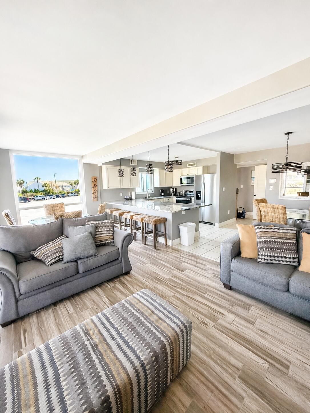 Welcome to Shoreline Towers III, where coastal living and investment potential come together in one exceptional opportunity. This beautifully furnished corner unit is truly turn-key and ready for immediate use as a primary residence, second home, or income-producing short-term rental. Thoughtfully designed with an open floor plan, the spacious living, dining, and kitchen areas flow seamlessly together, creating an inviting atmosphere for entertaining and relaxing after a day at the beach.

The kitchen features a large breakfast bar with ample seating and overlooks the main living area, allowing everyone to stay connected. Tasteful furnishings and décor are included, making this a hassle-free purchase for buyers looking to begin enjoying or renting the property immediately. The enclosed balcony  provides additional square footage and enhances the overall functionality of the unit.

Shoreline Towers is a gated Gulf-front community with a 24-hour guard-gated entrance and 460 feet of private sugar-white sand beach along the Emerald Coast. Residents and guests enjoy an impressive selection of resort-style amenities including a large swimming pool, fitness center, sauna, tennis courts, shuffleboard courts, clubhouse, grilling area, picnic space, and a scenic fishing lake. Covered parking is available in the parking garage, and boat trailer parking is also offered.