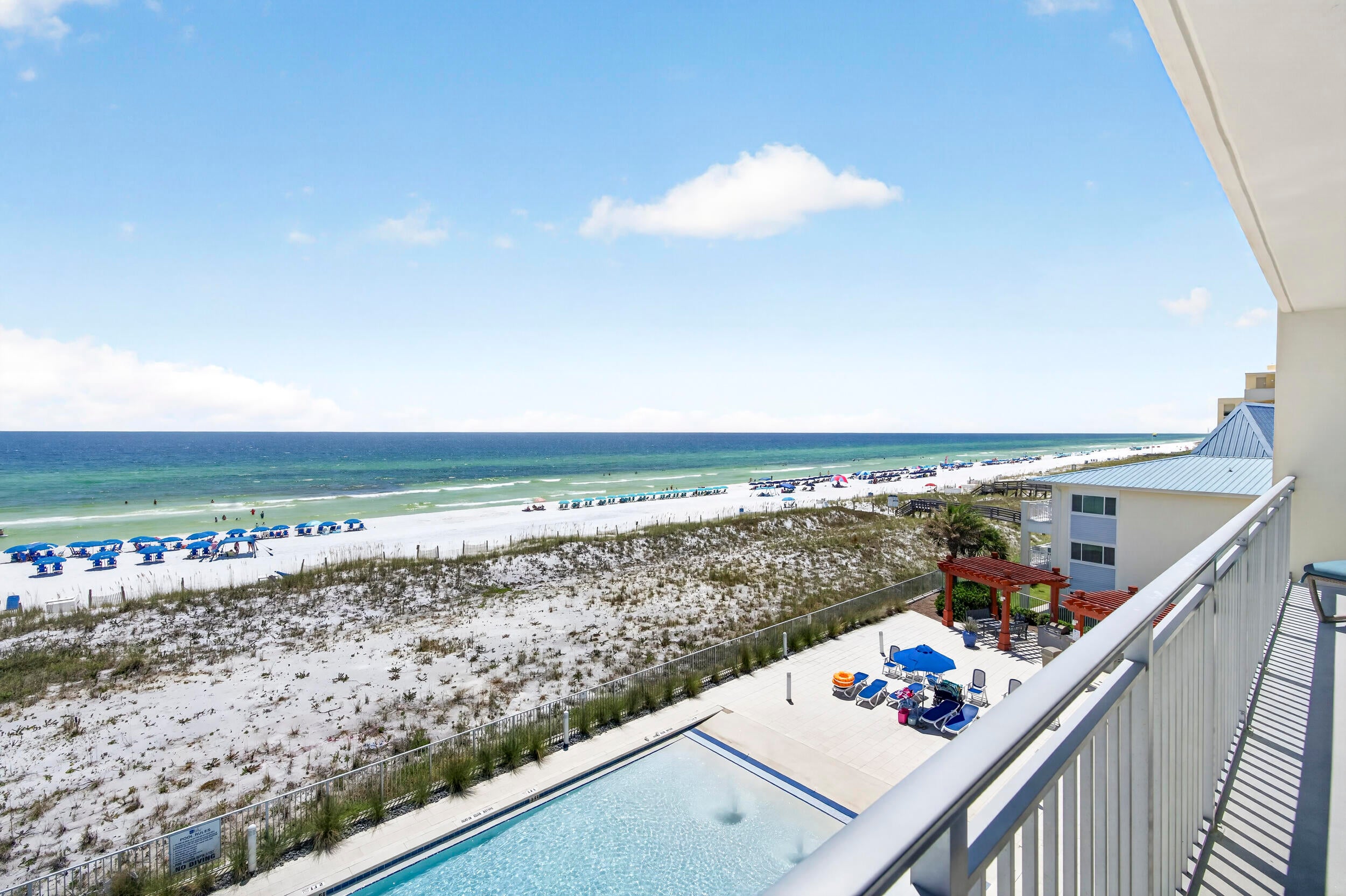 Experience the best of Gulf-front living in this beautifully appointed condo, perfectly situated along the emerald waters and sugar-white sands of Okaloosa Island. Built in 2019, this is one of the island's newer condominium developments, combining a fresh coastal feel with an exceptional beachfront location. This desirable Plan B floor plan boasts approximately 1,837 square feet of living space plus an impressive 235-square-foot Gulf-front terrace, creating the perfect setting to relax, entertain, and enjoy the coastal breeze and beautiful views. Professionally decorated by Sugar Beach Interiors, the condo offers a polished coastal style that complements its spectacular Gulf-front setting. The spacious layout features three bedrooms plus an additional flex room that could easily serve as a fourth sleeping area, home office, media room, or bonus space. The family chef will appreciate the gourmet kitchen outfitted with quartz counter tops, stainless appliances including a gas range, custom cabinetry and counter height bar. The Gulf front primary bedroom provides a comfortable private retreat, with access to the balcony, adding to the appeal of this well-designed floor plan. With a proven rental history, this property is an excellent opportunity for those looking for a vacation home, second residence, or established rental investment on the Emerald Coast. The gated community offers resort-style amenities, including two swimming pools, a hot tub, and a fitness center. Step outside and enjoy the sugar-white sand and emerald-green waters of the Gulf just beyond your door. Conveniently located near wonderful dining, shopping, boating, fishing, and water activities, this condo offers the perfect combination of relaxation, recreation, and convenience. From mornings overlooking the Gulf to evenings on your spacious terrace, this beautiful Okaloosa Island property offers an exceptional opportunity to own your own piece of paradise.