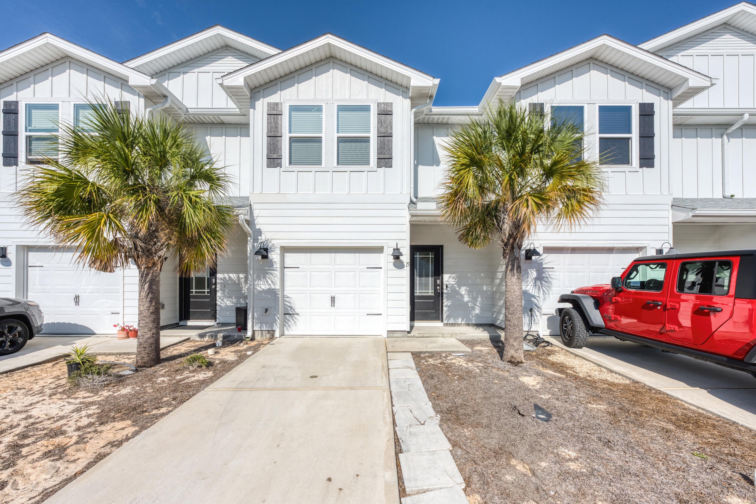 Available now!!!!  This amazing townhome places you minutes away from the beautiful beaches of the Emerald Coast.  Immaculate home has been well cared for and has easy access to bases, beaches, and shopping.  3-bedroom, 2.5-bath townhome, nestled just minutes from Harbor Walk Village and all that Destin has to offer. This home is a perfect blend of coastal living and modern convenience. Inside, you'll be greeted by an open floor plan that boasts an oversized kitchen with a large breakfast bar, stunning farmhouse sink, quartz countertops, crisp white cabinetry, and sleek stainless-steel appliances. The home's bright and airy ambiance is complemented by raised ceilings and premium vinyl plank flooring throughout, ensuring easy maintenance and a modern feel. Upstairs you will find 3 spacious bedrooms, 2 full size bathrooms and laundry closet. 1 car garage, 1/2 bath downstairs for the guests and back patio for enjoying the sunsets. No inside smoking or vaping in the home or garage.  Pets allowed with owner approval and $400 non-refundable pet fee.  This is a must see for location.