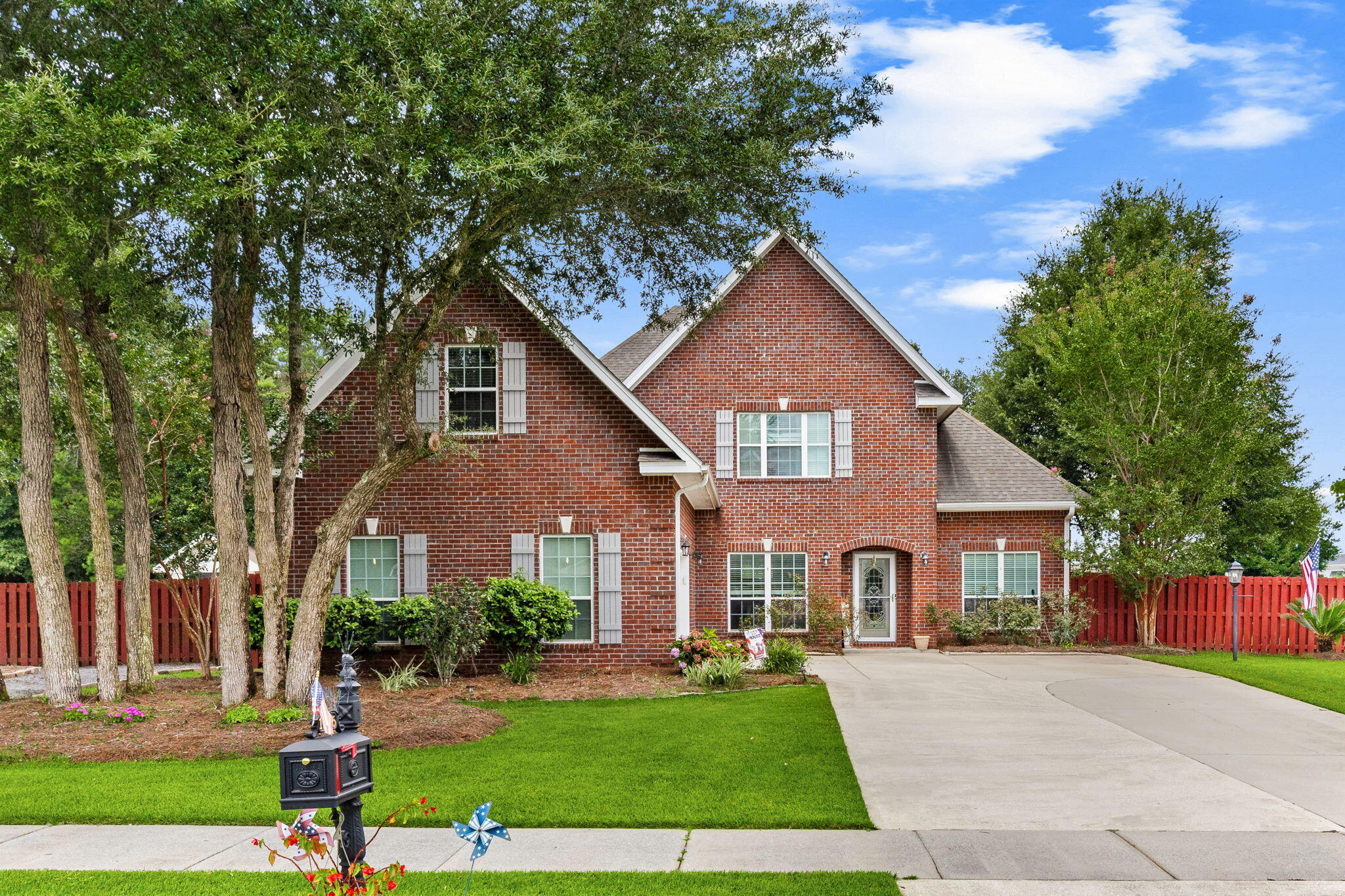SELLER NOW OFFERING $10,000 IN BUYER INCENTIVES!  Seller is offering up to $10,000 toward Buyer's closing costs, interest rate buy-down, and/or other allowable expenses -- PLUS a one-year home warranty! Take advantage of these valuable incentives and make your move with less out-of-pocket expense at closing!

Welcome to 12815 Merial Pass, a two-story brick home located in Phase I of the highly sought-after gated Lake Merial community, where timeless architecture, spacious living, and resort-style outdoor amenities come together to create an exceptional place to call home. Situated on a nearly half-acre corner lot with picturesque views of beautiful spring-fed Lake Merial, this impressive residence offers approximately 3,199 heated and cooled square feet, including 4 bedrooms, 3.5 bathrooms, and a spacious upstairs bonus room that could easily serve as a fifth bedroom, media room, playroom, or home office.

Built in 2014, this home offers outstanding curb appeal with its classic brick exterior, dimensional shingle roof, manicured landscaping, and fenced backyard. Inside, you'll find a thoughtfully designed floor plan featuring approximately 2,304 square feet on the main level and an additional 895 square feet upstairs. 

 Step through the front door into an inviting foyer, where a formal dining room welcomes guests on one side and a dedicated home office sits on the other. Throughout the home, elegant crown molding, neutral finishes, engineered hardwood flooring, luxury vinyl plank flooring in the downstairs bedrooms, and ceiling fans in every bedroom create a warm yet sophisticated atmosphere.

The spacious living room features beautiful tray ceilings and flows seamlessly into the open-concept kitchen, making it the perfect gathering place for family and friends.

Throughout the home, elegant crown molding, neutral finishes, engineered hardwood flooring, luxury vinyl plank flooring in the downstairs bedrooms, and ceiling fans in every bedroom create a warm yet sophisticated atmosphere.

The spacious living room features beautiful tray ceilings and flows seamlessly into the open-concept kitchen, making it the perfect gathering place for family and friends.

Designed with both function and style in mind, the kitchen offers abundant cabinetry, generous countertop space, and updated appliances, including a stove and dishwasher that are approximately two years old and a refrigerator that is approximately three years old. Just off the kitchen, a convenient half bath provides easy access for guests.

The primary suite serves as a relaxing retreat, complete with a tray ceiling and a well-appointed ensuite bathroom featuring dual vanities, a soaking garden tub, separate walk-in shower, and spacious walk-in closet.

Step outside and discover a backyard designed for enjoying the Florida lifestyle year-round. Installed in 2022, the saltwater pool and attached hot tub create an incredible outdoor oasis for relaxing or entertaining. The pool is equipped with both a heater and chiller, allowing you to comfortably enjoy the water throughout every season. The fully fenced backyard also includes a storage shed, while a newer irrigation well helps efficiently maintain the lawn and landscaping while reducing water costs. New sod has recently been added to enhance the front yard's curb appeal.

Comfort is maintained throughout the home with dual HVAC systems, allowing separate climate control for both the upstairs and downstairs living areas.

Upstairs you'll find a massive bonus room that offers endless possibilities and could easily function as a fifth bedroom, game room, media room, fitness space, or additional family room. An additional upstairs bedroom and full bathroom make this level ideal for guests, teenagers, or multigenerational living.

Living in Lake Merial means more than simply owning a beautiful home, it is embracing an exceptional lifestyle. Residents enjoy access to the community's stunning 300-acre spring-fed lake, where kayaking, paddleboarding, fishing, and electric-powered boating create endless opportunities for outdoor recreation. Three community lake access areas make enjoying the water effortless, while scenic walking trails, green spaces, food truck nights, neighborhood events, holiday celebrations, and golf cart-friendly streets foster a true sense of community unlike anywhere else in Bay County.

If you've been searching for a home that combines generous living space, timeless construction, resort-style outdoor amenities, beautiful lake views, and one of Bay County's most desirable gated communities, this exceptional Lake Merial property is one you won't want to miss. Schedule your private showing today.