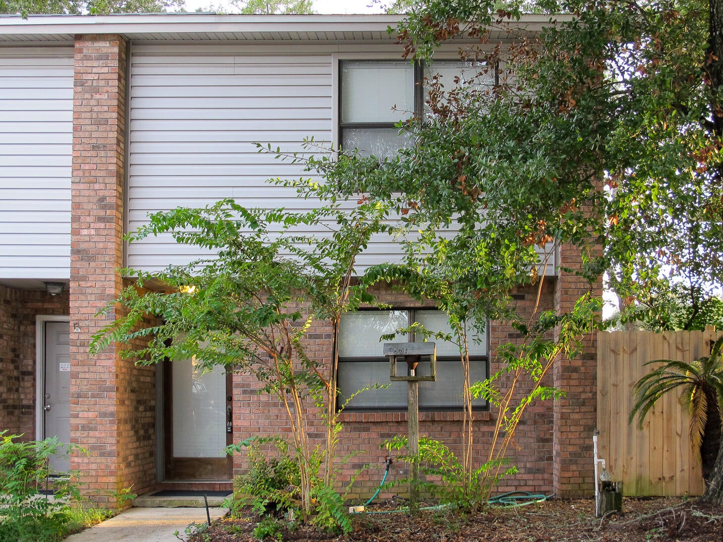 Delightful 2-bedroom 1.5-bath townhome with Florida room. Fresh paint, new blinds, new stove and dishwasher. Upgraded kitchen, all wood-look laminate and tile flooring...no carpeting. Laundry is accessible from the Florida Room, including washer/dryer and lots of storage. End unit with side yard and yard building, small open patio. Natural landscaping, no lawn to care for. No smoking, no pets. First month's rent and security deposit to move in. Background check $55. Call for your showing today!