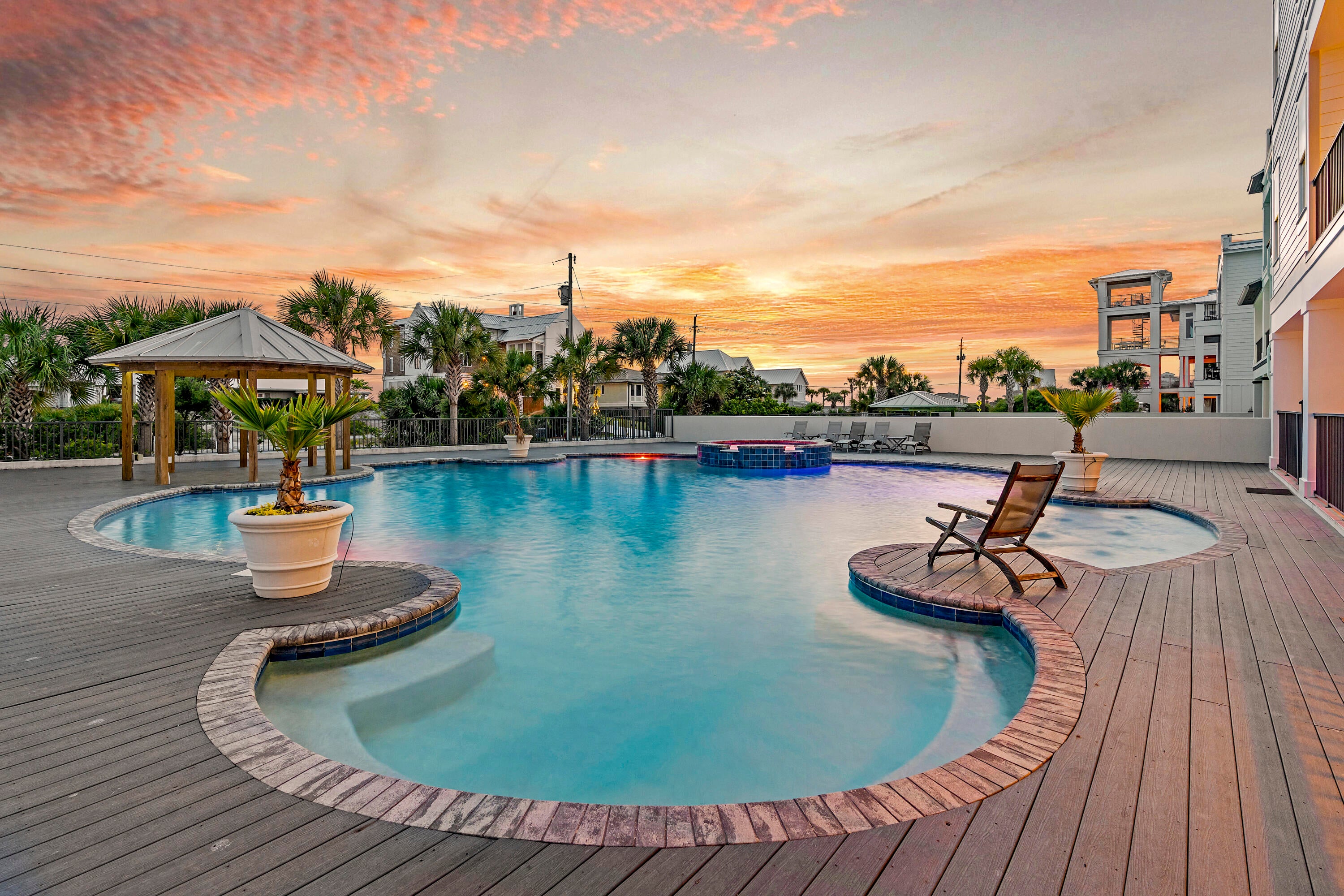 Extensively updated within the past year, list of improvements is available upon request. Perfectly positioned along scenic 30A, this striking coastal contemporary estate captures sweeping Gulf views from all three interior levels, crowned by an expansive fourth-floor rooftop deck designed for unforgettable sunsets.

Thoughtfully designed for both luxury living and high-performing investment potential, the home features an open-concept layout with multiple indoor and outdoor gathering spaces, all enhanced by professionally curated furnishings and high-end finishes by Duce & Co. Elevated to maximize its vantage point, the property showcases exceptional sightlines over the Gulf from nearly every angle. At the heart of the outdoor experience is one of the largest private pools on 30A--a stunning 50,000-gallon resort-style pool by Watermark, complete with an adjoining spa and covered gazebo. The oversized pool deck creates a true private retreat, ideal for entertaining on a grand scale.

This property is not just beautiful--it's a proven income producer, generating just under $400,000 annually in rental income (actuals, not projections), even with significant owner use. Meticulously maintained, the pride of ownership is evident throughout.

Notable features include:
Private elevator servicing all three floors.
Multiple master suites, including one Gulf-view master suite with a spa-inspired bathroom featuring floor-to-ceiling stone tile.
Custom built-in bunk rooms for added sleeping capacity.
Multiple indoor and outdoor living areas.
Two garage bays with the option for owner lockout.
Immediate beach access located adjacent to the home.
Three dishwashers, one on the 1st floor and two on the 2nd floor.
One wine cooler on the 1st floor and one on the 3rd floor.

The first floor offers two spacious bedrooms with en-suite baths, plus a half bath which can be directly accessed from the pool area, along with a large secondary living area featuring a game space and wet bar--perfectly positioned for seamless access to the outdoor kitchen adjoining the pool deck.

The second floor serves as the main living hub, highlighted by floor-to-ceiling glass doors framing Gulf views. The expansive living room flows into a designer kitchen and dining area featuring custom cabinetry, quartz countertops, stainless steel appliances, and an oversized island with integrated seating. This level also includes two additional bedrooms with en-suite baths, a powder room, and access to two outdoor living spaces, with one overlooking the pool and Gulf.

The third floor is dedicated to rest and retreat, featuring four bedrooms including multiple master suites, a secondary living area/den, laundry, and additional bunk accommodations. Two outdoor living spaces provide areas to relax, with one overlooking the pool and the Gulf.

The rooftop deck showcases breathtaking, panoramic views of both the Gulf and nearby coastal lake, with a prized western exposure for stunning sunsets.

Located in the heart of Dune Allen Beach, this exceptional property offers convenient access to boutique shopping, acclaimed dining, and all that 30A has to offer--making it the ultimate blend of lifestyle, luxury, and investment opportunity, along with an array of outdoor recreational activities and local entertainment that 30A has to offer.
