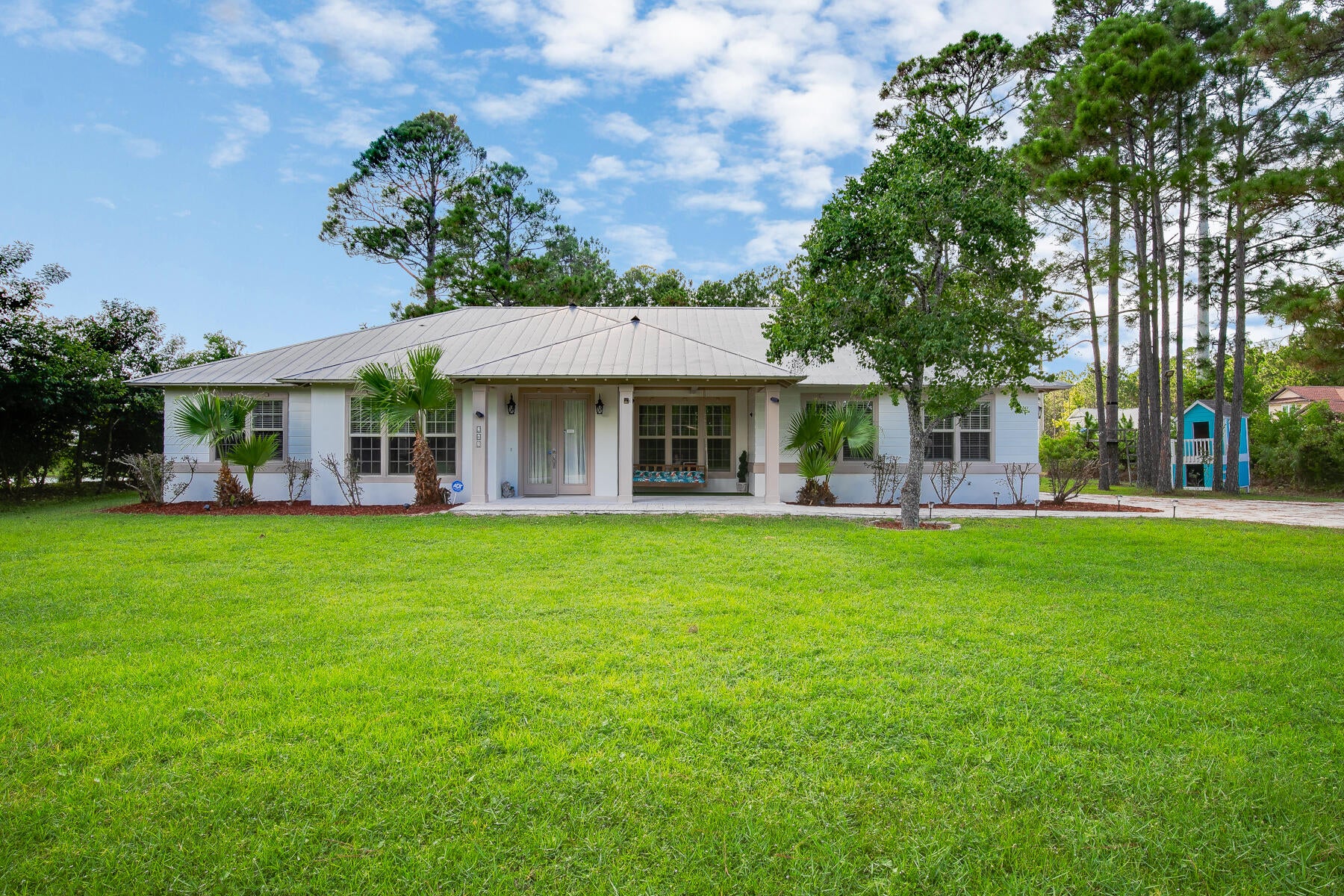 Beautifully renovated, fully furnished, and move-in ready, this inviting home offers an exceptional blend of style, comfort, and versatility just minutes from the Emerald Coast's renowned beaches, shopping, and dining. Thoughtful updates include new tile flooring throughout, new stainless steel appliances, custom finishes, and a durable metal roof. The well-designed floor plan features a flexible bonus room ideal for a home office, guest retreat, or creative space, while the primary suite is enhanced by a charming bay window bench. One of the property's most distinctive features is the impressive 35' x 22' workshop, providing exceptional space for hobbies, projects, recreational equipment, or additional storage. Outdoors, the spacious backyard offers plenty of room to entertain, relax, and enjoy the Florida lifestyle, complete with a fun zip line. With its extensive updates, generous indoor and outdoor spaces, valuable workshop, and convenient location, this turnkey property is ready to welcome its next owner.