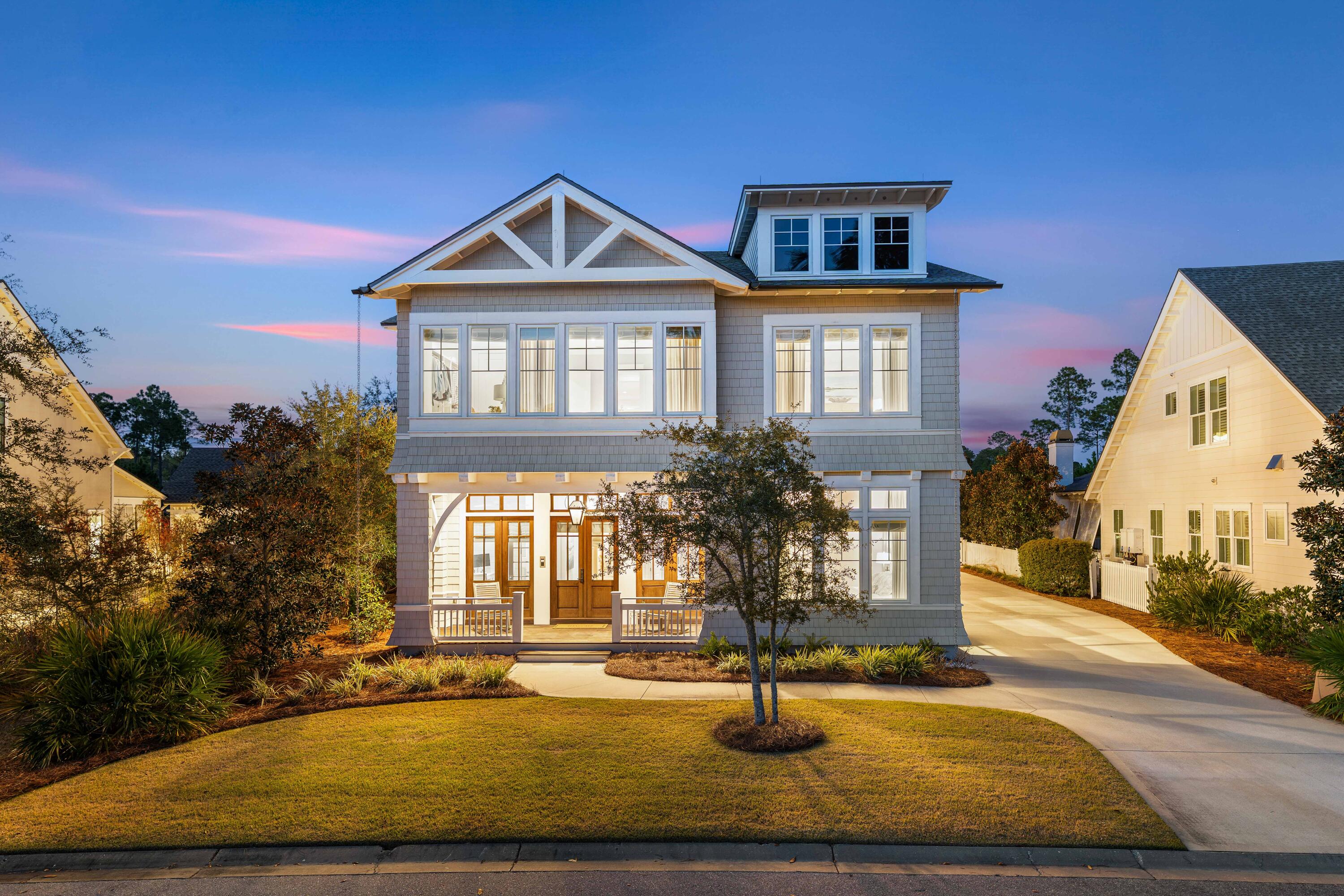 Welcome to 55 Seastone Court—a rare opportunity to own a move-in-ready estate brimming with sophistication, privacy, and coastal luxury in the heart of WaterSound Origins - the quintessential master planned community near 30A. This remarkable five-bedroom, six-bathroom residence comes thoughtfully furnished with designer pieces and minimum exclusions, fine art by Allison Wickey, curated for effortless living, offering a seamless transition for those seeking an immediate start to their elevated Gulf Coast lifestyle.
Nestled on a quiet, tree-lined street and facing a peaceful park, this custom-built architectural masterpiece was imagined by Chris Stoyles and expertly crafted by Turner Legacy Homes in 2020. The home graces a premium lot and blends New England-inspired design with the relaxed refinement of Florida's Emerald Coast. Sunlight pours through expansive Sierra Pacific windows, illuminating wide-plank hardwood floors that run throughout the open-concept living spaces. Soaring 11-foot ceilings on main level, custom lighting, and 4 elegant gas/electric fireplaces with hand-crafted mahogany mantles create a warm atmosphere perfect for both quiet evenings and lively gatherings.  Additionally, a gas fire-pit on the screened-in, Ipe wood porch overlooks the heated pool and the waterfront. 
The heart of the home is its striking chef's kitchen, a showcase of Marquis Fine Cabinetry's Milano cabinetry, exquisite quartz countertops, and a suite of Wolf, Sub-Zero, Fisher & Paykel and Bosch appliances. Entertain with ease thanks to dual wet bars, a full-length wine cellar, and a convenient pass-through window to the covered summer kitchen outside. Folding Euro-Wall glass doors invite the outdoors in, unveiling a private backyard oasis complete with a saltwater infinity-edge, heated pool, spa, cabana with gas fireplace, and serene pond views. Dine al fresco by the fire pit, unwind around the cabana's gas fireplace and overhead heaters, or enjoy year-round comfort with motorized screens and a fully equipped summer kitchen.
The main level primary suite is a true sanctuary, featuring floor-to-ceiling windows, remote-controlled drapery, an electric fireplace, and a spa-inspired bathroom with imported finishes and a boutique-style custom closet. The main level also features an office. Upstairs, a secondary primary suite, two additional en-suite bedrooms, a second laundry room, and a spacious media or gathering room with surround sound, gas fireplace, wine fridge and a large screened-in, Ipe wood porch offering an abundance of space for family and guests - indoors & out. The carriage house above the two-car garage presents a private apartment with a living area, kitchenette, bedroom, and bathideal for extended stay guests or flexible use.
Every detail of this exceptional residence has been consideredfrom whole-home Control4 automation and a 22 KW Generac generator to dual-zone HVAC, advanced security, lightning protection, and luxurious epoxy-finished garage floors. Located just moments from WaterSound Origins' golf course, tennis and pickleball courts, fitness center, pools, and the vibrant Town Center with shopping, dining, and daily conveniences, this home delivers the perfect blend of comfort, luxury, and accessibility.
Begin your next chapter at 55 Seastone Courtwhere every element is crafted for lasting memories and an extraordinary coastal lifestyle.