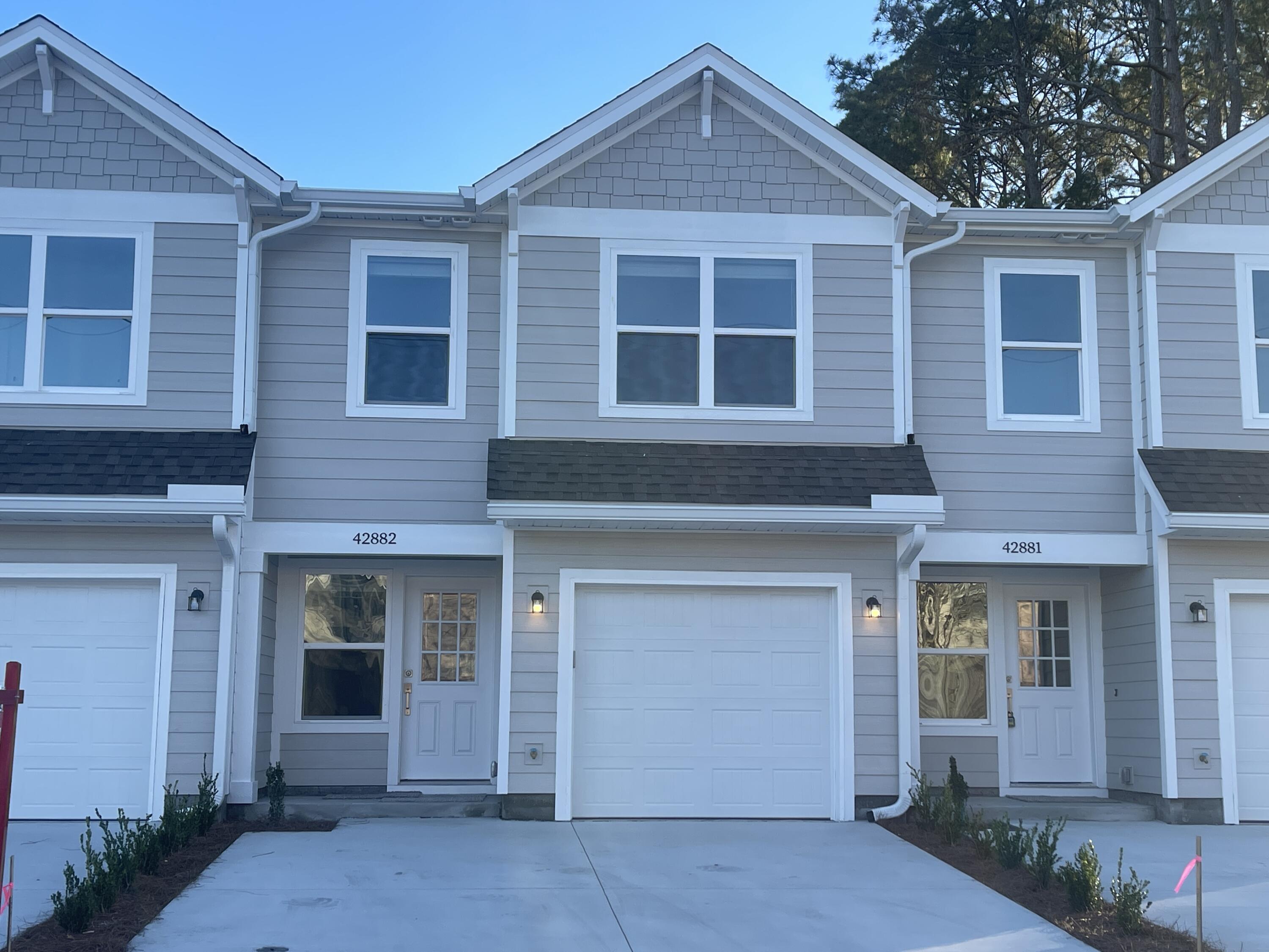 Ideally located in Niceville, this thoughtfully designed 3-bedroom, 2.5-bath townhome offers modern comfort and convenience just minutes from military bases, stunning Gulf Coast beaches, top-rated schools, shopping, dining, and entertainment.

The spacious first floor features an open-concept layout with a bright living area, dining space, and a stylish kitchen designed to impress. High-end finishes include granite countertops, stainless steel appliances, white shaker cabinetry, and elegant details throughout. A convenient half bath is also located on the main level, making it perfect for both everyday living and entertaining guests.

Upstairs, you'll find a private primary suite complete with a walk-in closet and a well-appointed en-suite bathroom. Two additional guest bedrooms and a full guest bathroom provide plenty of space for family members, guests, or a home office. Quality construction and modern finishes create a welcoming atmosphere throughout the home.

Additional features include a one-car garage, washer and dryer hookups, and energy-efficient new construction. Pets may be considered on a case-by-case basis with prior owner approval and a non-refundable pet fee. No smoking is permitted, including e-cigarettes and vaping products.

Don't miss this opportunity to enjoy low-maintenance living in a beautiful new home in one of Niceville's most convenient locations.
