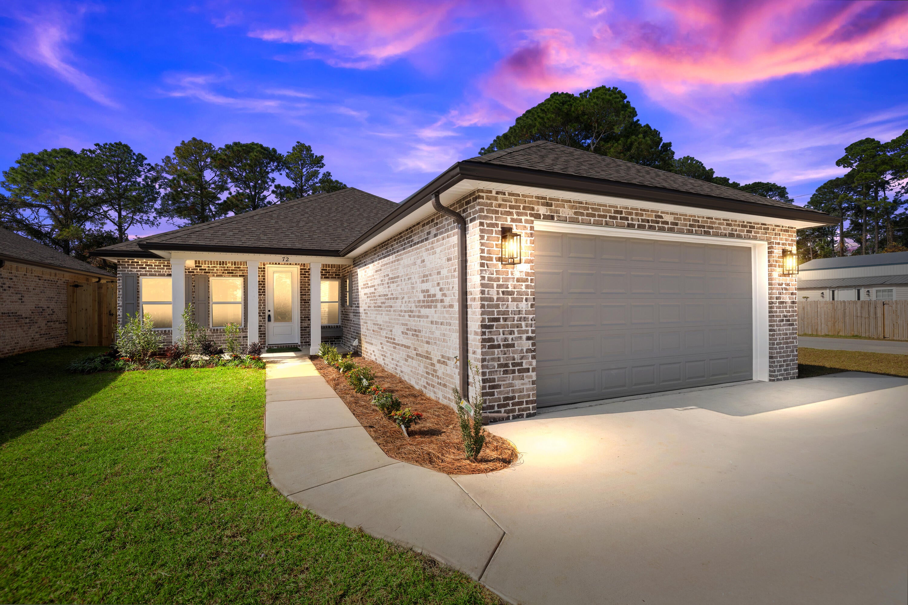 Beautiful 4-bedroom, 2-bath all-brick home situated at the east end of Niceville. The seller pays 10,000 towards the buyer's closing cost, doc stamps on the deed, & all title insurance and title fees.  You'll absolutely love this open floor plan featuring 9ft. ceilings throughout and 10ft where reverse trey ceilings are located. This home boasts many custom amenities throughout. The kitchen is divine, featuring white custom cabinets, soft close drawers, farm sink, pantry, undermount lighting under cabinets and quartz countertops throughout. The island bar has an 18-inch over-hang, a reverse trey ceiling in the family room with changeable lighting for seasonal events.  Enjoy the convenience of a floor outlet in the family room, perfect for lamps or phone chargers without obstructing walkways. Love entertaining? The kitchen and family room open up to a screened porch to relax with an extra paver pad for grilling and an extra patio set. The master bedroom has a reverse trey ceiling with recess lighting and opens to a custom master bath. Everything about the primary bath is inviting! Unwind in the single standing 6ft deep soaker tub or take a hot shower which boast custom tile with a rainhead, 2nd sprayer in front, a bench for sitting with a 3rd hand-held sprayer next to the bench and finished out with seamless glass. Enjoy the custom built full-length built in mirror, LED backlighting behind the mirrors above the double vanities and a beautifully designed custom closet. The laundry room has a custom folding table with quartz countertop, and shelving. When you want to relax, and rewind, the back yard is the place. You'll enjoy a screened in porch with ceiling fan, fully sodded yard, full gutters, sprinkler system that works off a separate well and a 8 ft. privacy fence. This home has everything and new construction all around. For energy efficiency, the builder has installed upgraded spray foam in the roof and high impact windows.  You will also enjoy the storage above the garage. This builder takes great pride in his homes and it shows! Your minutes away from the restaurants, a large park with boat launch and Eglin Air Force Base, Special Forces, Emerald Coast beaches, shopping, and hospitals. The home will be completed October 10, 2026.