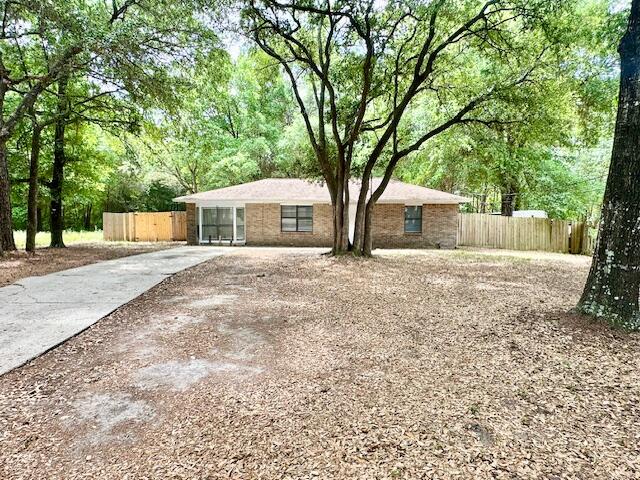 Available: 9/15. Flexible security deposit = to 1 months rent can be broken up in 2 monthly installments, if qualified. Pets allowed upon owners approval w/ a pet fee. This single-story, all-brick home boasts a spacious layout w/ a split bedroom plan maximizing privacy. The garage was converted into the master suite w/ a bay window & a large soaking tub. The home features ceramic tile & LVP flooring throughout, no carpet! The separate utility room adds convenience & the ceiling fans throughout ensures comfort all year round! The open back patio & large privacy fenced backyard provide ample space for outdoor enjoyment. This all-electric home is soon to be upgraded w/ a new fridge & range hood. Its location on John King Road & south of I-10 offers easy access to everything, both far & near. This home is a perfect blend of comfort, convenience & charm!