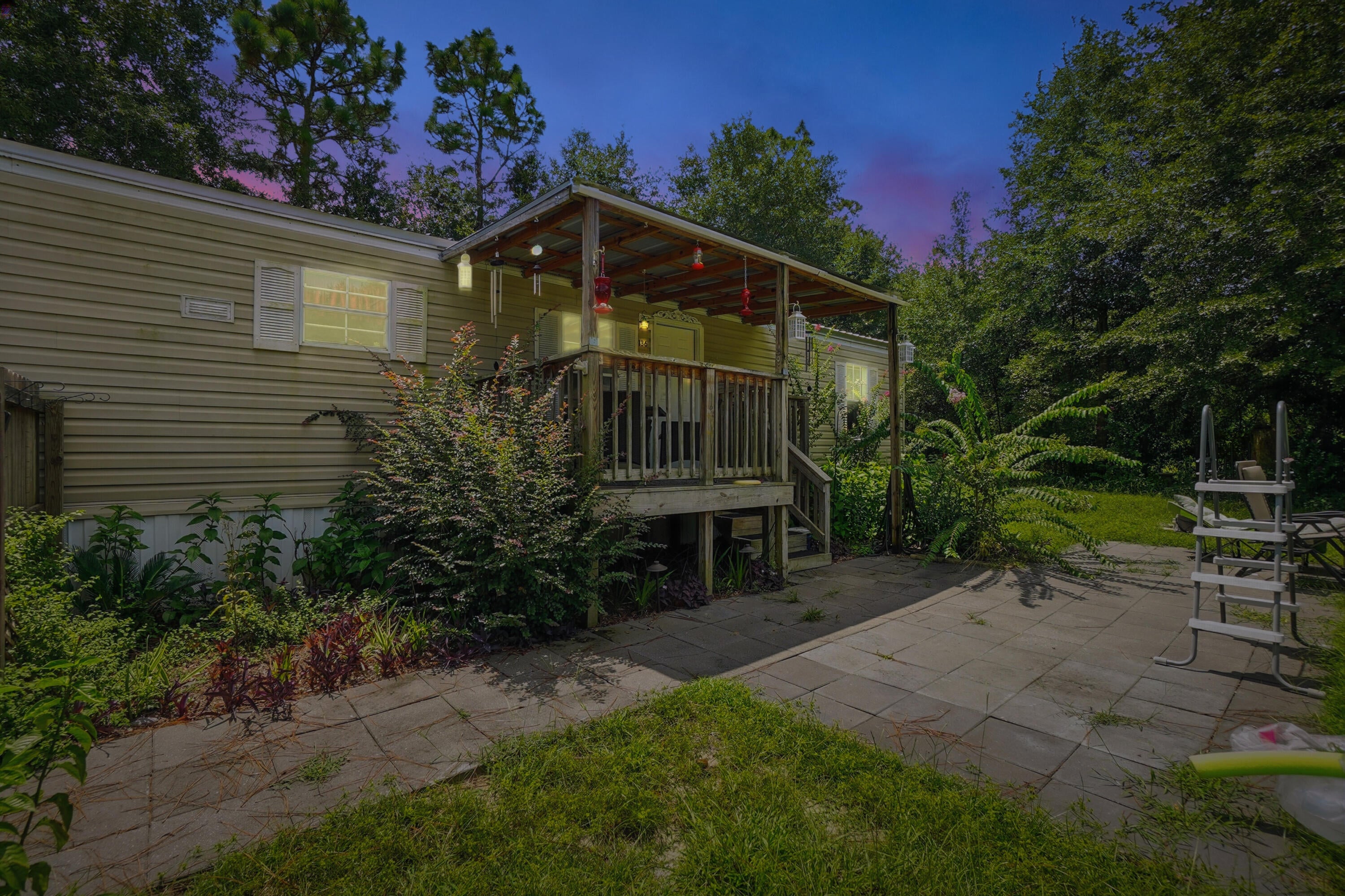 Welcome to this charming 2-bedroom, 2-bathroom manufactured home, offering a perfect blend of comfort and convenience. This home features several updates, ensuring modern living in a peaceful setting. The spacious bedrooms provide plenty of room to unwind, while the inviting living area includes a gel fuel fireplace, adding warmth and relaxation with minimal effort. Both bathrooms have tub/shower combos.
Step outside to discover your very own private oasis! The large patio area is perfect for outdoor entertainment and relaxation. The yard is partially privacy fenced, offering seclusion and tranquility. Additional outdoor features include a back 9x9 patio, ideal for enjoying the outdoors, and a 20x20 covered carport to protect your