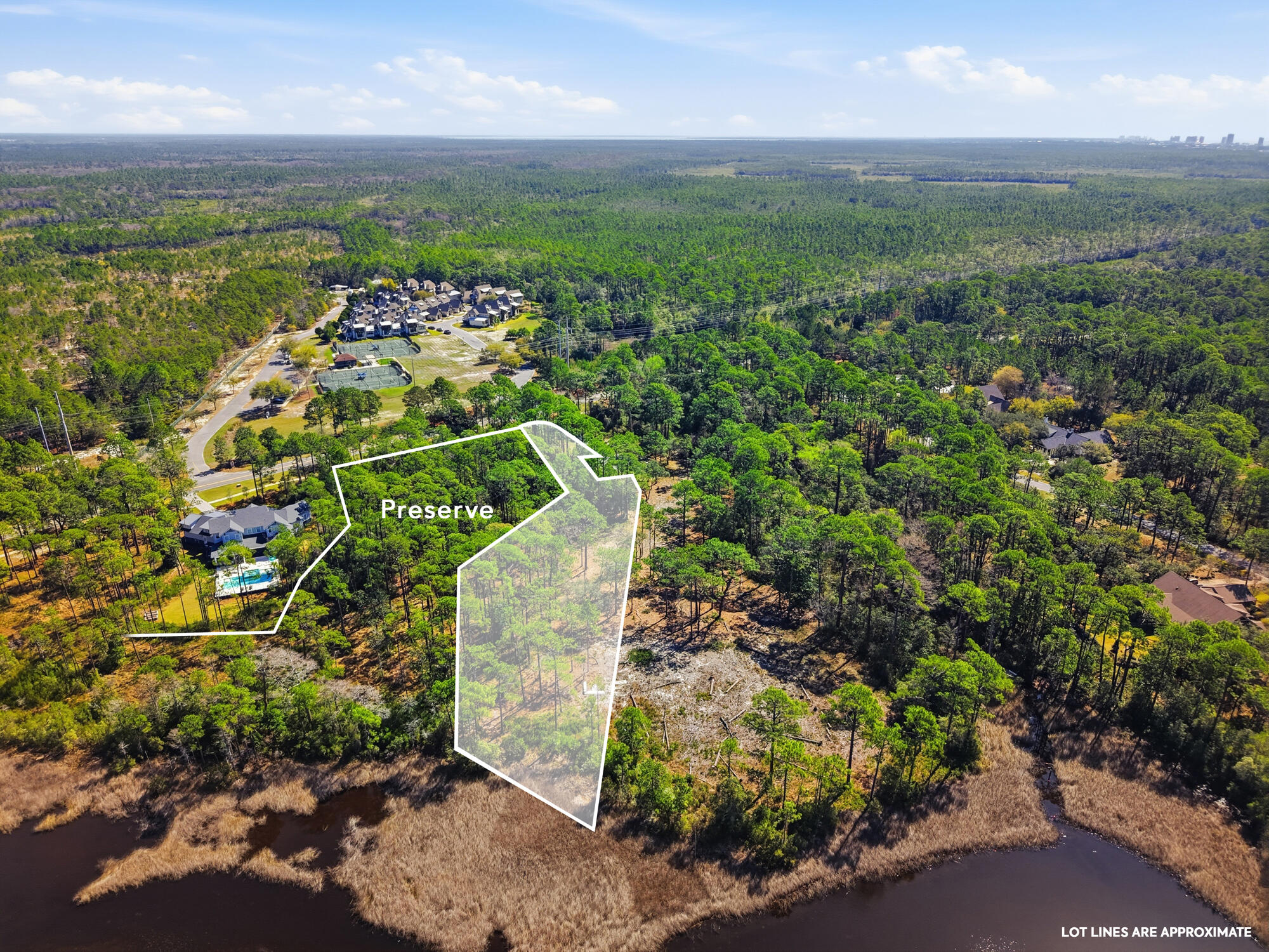 One of the largest waterfront homesites in Wild Heron, this exceptional 1.26-acre estate property offers a rare opportunity to build a custom luxury residence on the shores of Lake Powell, North America's largest coastal dune lake. Complete with a private boat slip, preserve frontage, and access to the Gulf of Mexico, this homesite combines privacy, natural beauty, and an unparalleled waterfront lifestyle.

Lake views, protected preserve, and only one neighbor on a private road create an extraordinary setting for a one-of-a-kind coastal retreat. With over an acre of prime waterfront land, there is ample space to design a remarkable estate with resort-style outdoor living, a pool and guest houses with nearly 20,000 buildable sq feet. 

Located within the exclusive gated community of Wild Heron, residents can enjoy the scenic walking trails around Greg Norman-designed Sharks Tooth Golf Course, a lakeside boathouse, resort-style pool, fitness center, tennis and pickleball courts. Just minutes from 30A, Rosemary Beach, and the Gulf's white-sand beaches, this property offers the perfect balance of luxury, recreation, and coastal serenity.

Rarely does a homesite of this size and caliber become available. Offering lake frontage acreage with only one neighboring lot, preserve views, a private boat slip, and access to one of the world's rarest coastal dune lake ecosystems, 22100 Trumpet Trail is an exceptional opportunity to create a unbelievable waterfront estate!