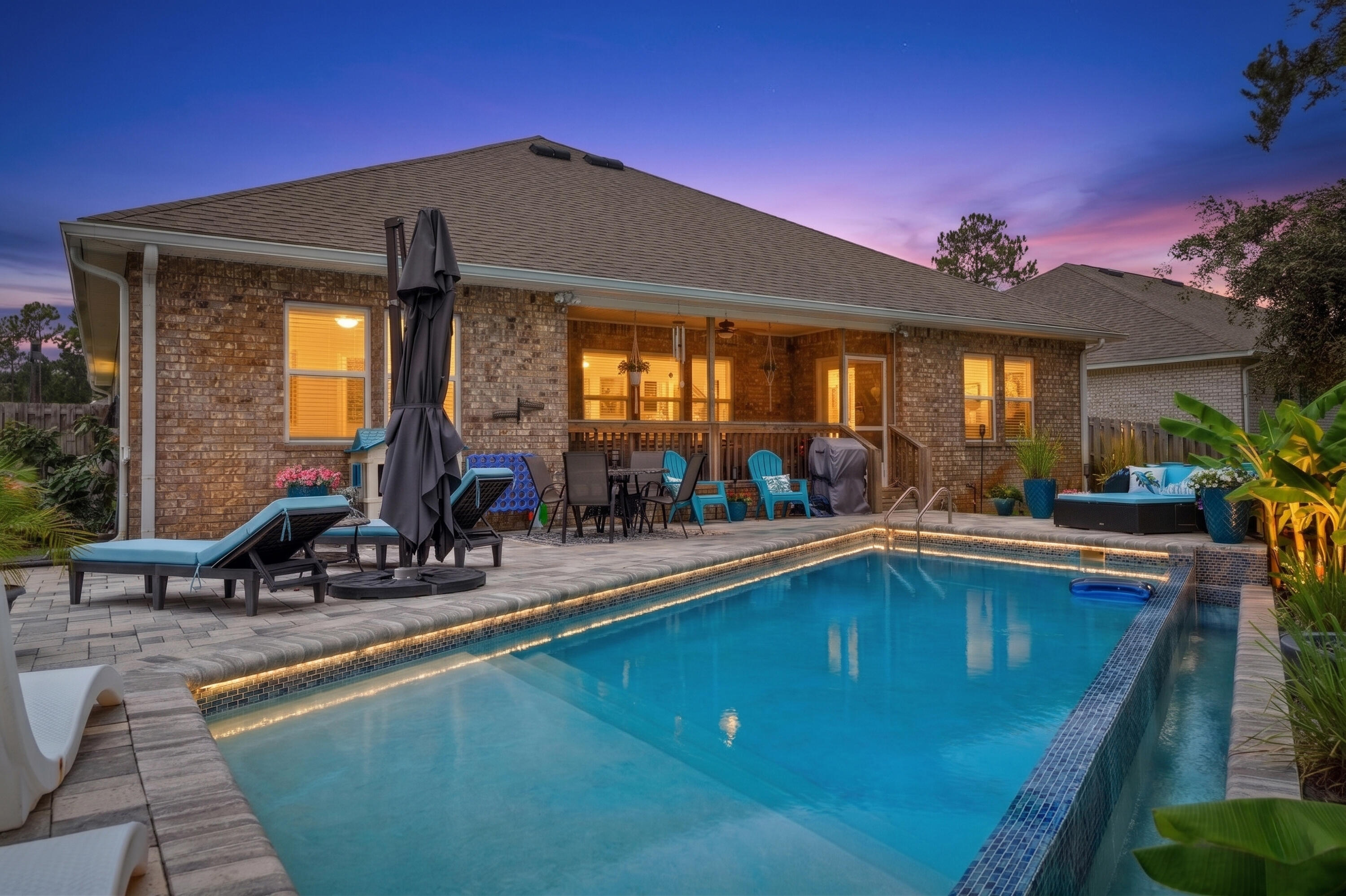 Rare opportunity to purchase this pool home with water views! Situated on an oversized lot in the sought-after Point Washington area, this beautifully upgraded home offers one of the most breathtaking backyards you'll find. Backing to a picturesque lily pond, this private outdoor oasis features a saltwater pool with an infinity ledge, LED lighting, brick paver patio, fire-pit area, and a spacious screened back porch designed for year-round enjoyment. Lush landscaping, swaying palm trees, banana plants, orange trees, and tranquil water views create a peaceful setting that feels like your own private retreat. 

Peach Creek is a charming neighborhood located minutes from 30A's sugar-white beaches, top-rated schools, restaurants, shopping, and is a short drive from iconic Seaside and Watersound Town Center. There is a walking path perfect for outdoor activities, and food trucks often visit the neighborhood. Head to the beach, swim in the pool, or enjoy Florida living on the back porch.

Inside you'll find durable LVP flooring throughout the main living areas, fresh interior paint, and updated ceiling fans and light fixtures that give the home a clean, modern feel. The gourmet kitchen offers a large island, spacious pantry, beautiful cabinetry with tile backsplash and new drawer pulls, stainless steel appliances, a dining area, and a dedicated breakfast space. The living room offers an inviting central gathering space with an open, comfortable layout ideal for entertaining and every day living.
 
The primary suite features stunning views of the pool and peaceful water beyond, along with an en suite with a  walk-in closet, large soaking tub with tile backsplash, separate walk-in shower, and double vanity, creating a true private retreat.

The 3 guest bedrooms are nice-sized and separated from the primary suite for privacy. The guest bathroom has a double vanity with granite counter tops and a shower tub combo. The half bathroom is updated with a beautiful new vanity. This home also features a dedicated laundry with cabinetry and smart home technology with smart lock and doorbell camera. 

Outside, the home continues to impress with beautiful landscaping, a fully fenced yard, irrigation system with rust removal treatment, whole-house gutters, and permanent exterior lighting that enhances curb appeal year-round. 

Schedule a showing today--this home is a gem! Buyer to verify all pertinent information in listing.